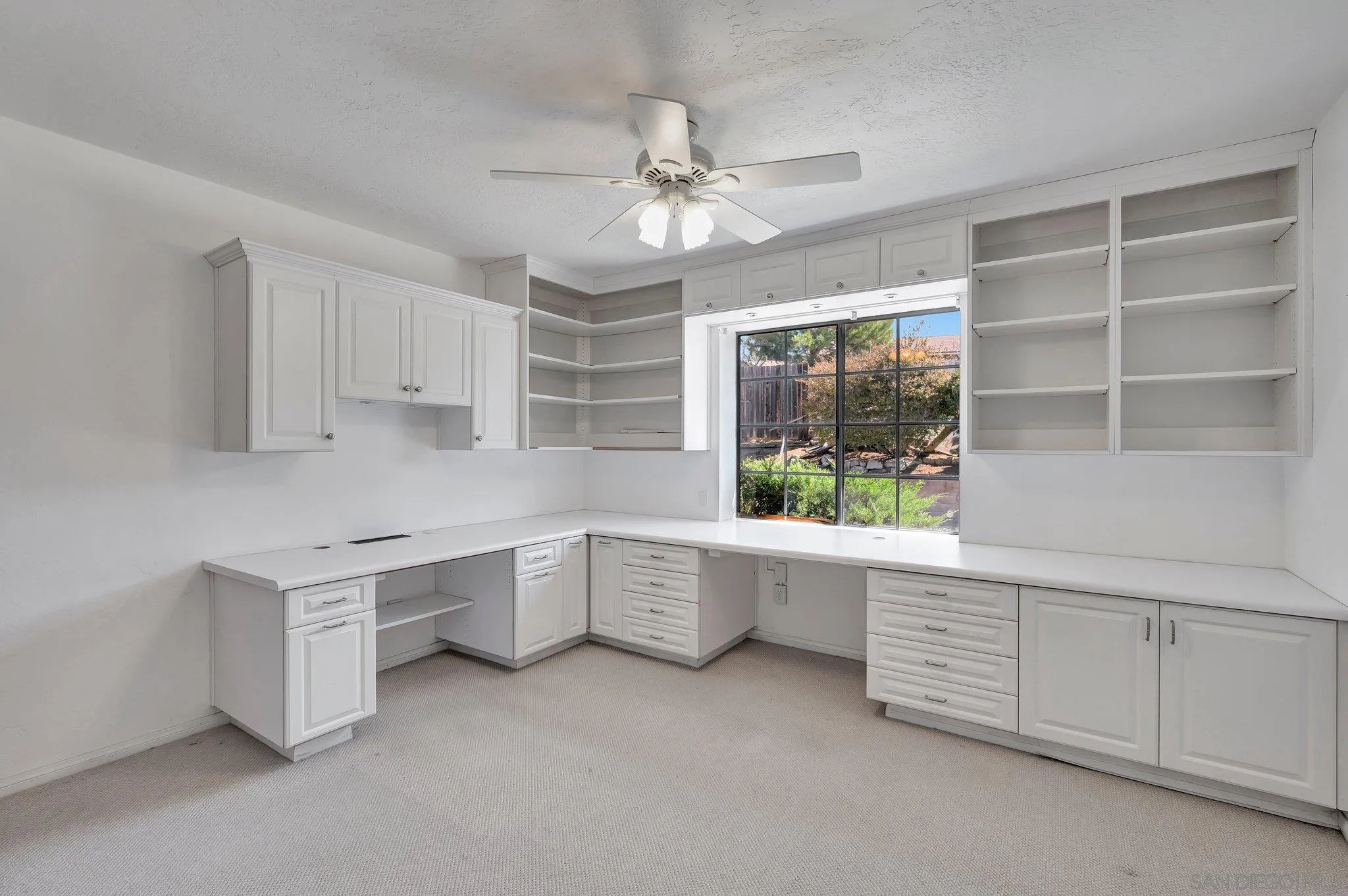 2596 Valetta Lane Alpine, CA 91901 - Photo 27 of 48 a kitchen with white cabinets and window