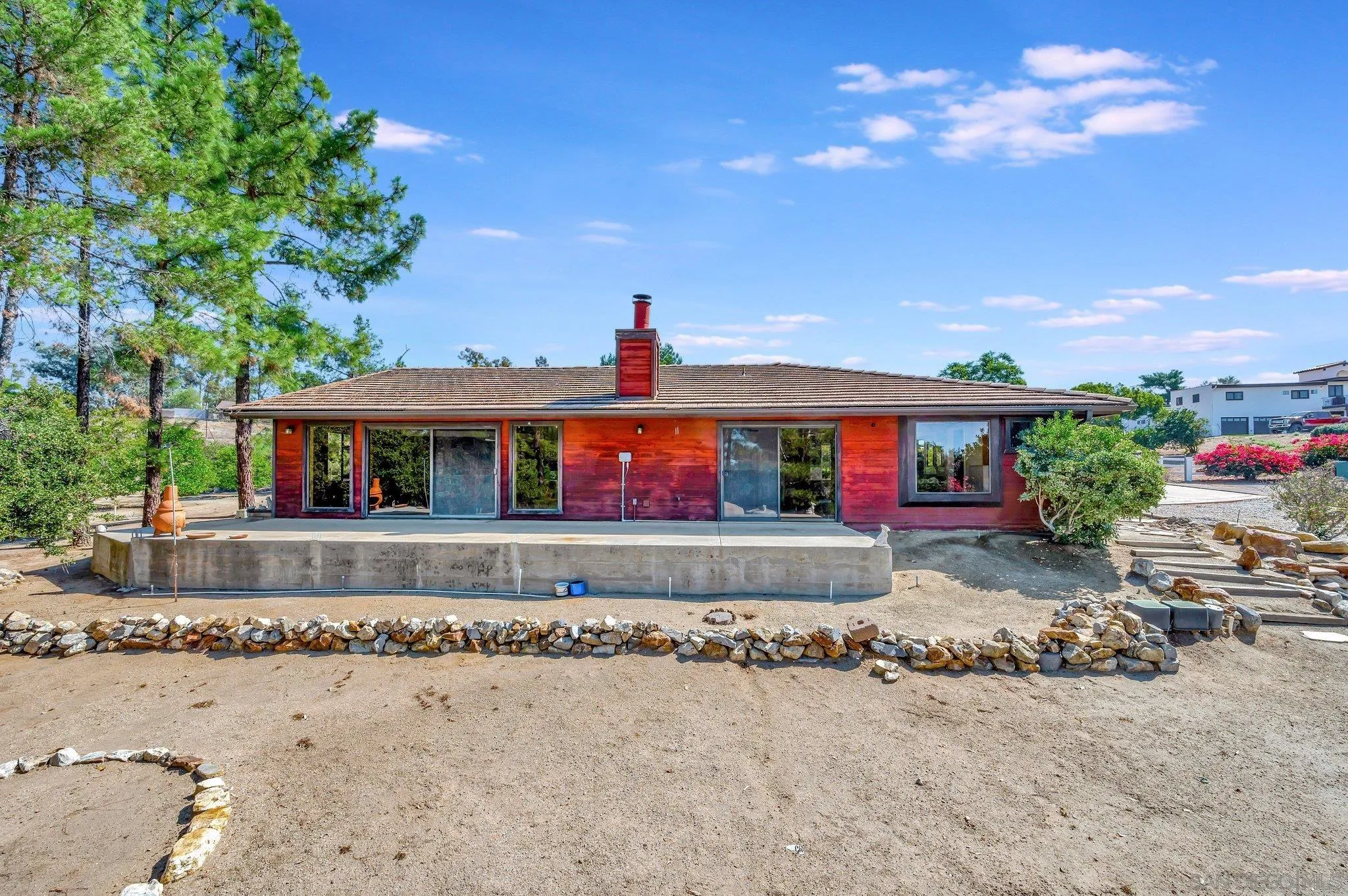2596 Valetta Lane Alpine, CA 91901 - Photo 34 of 48 a view of a house with a yard and a garage