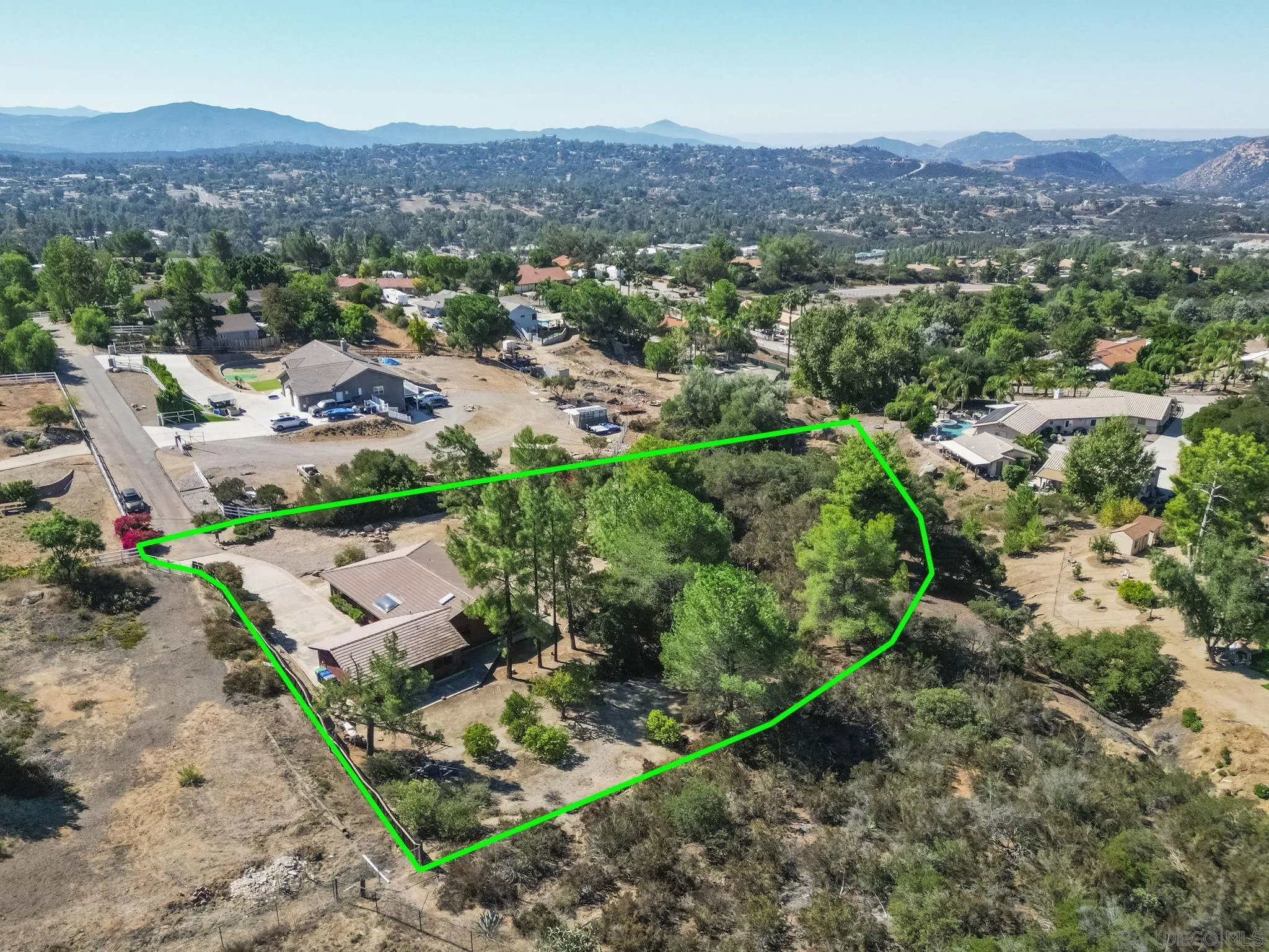 2596 Valetta Lane Alpine, CA 91901 - Photo 46 of 48 an aerial view of green landscape with trees and houses