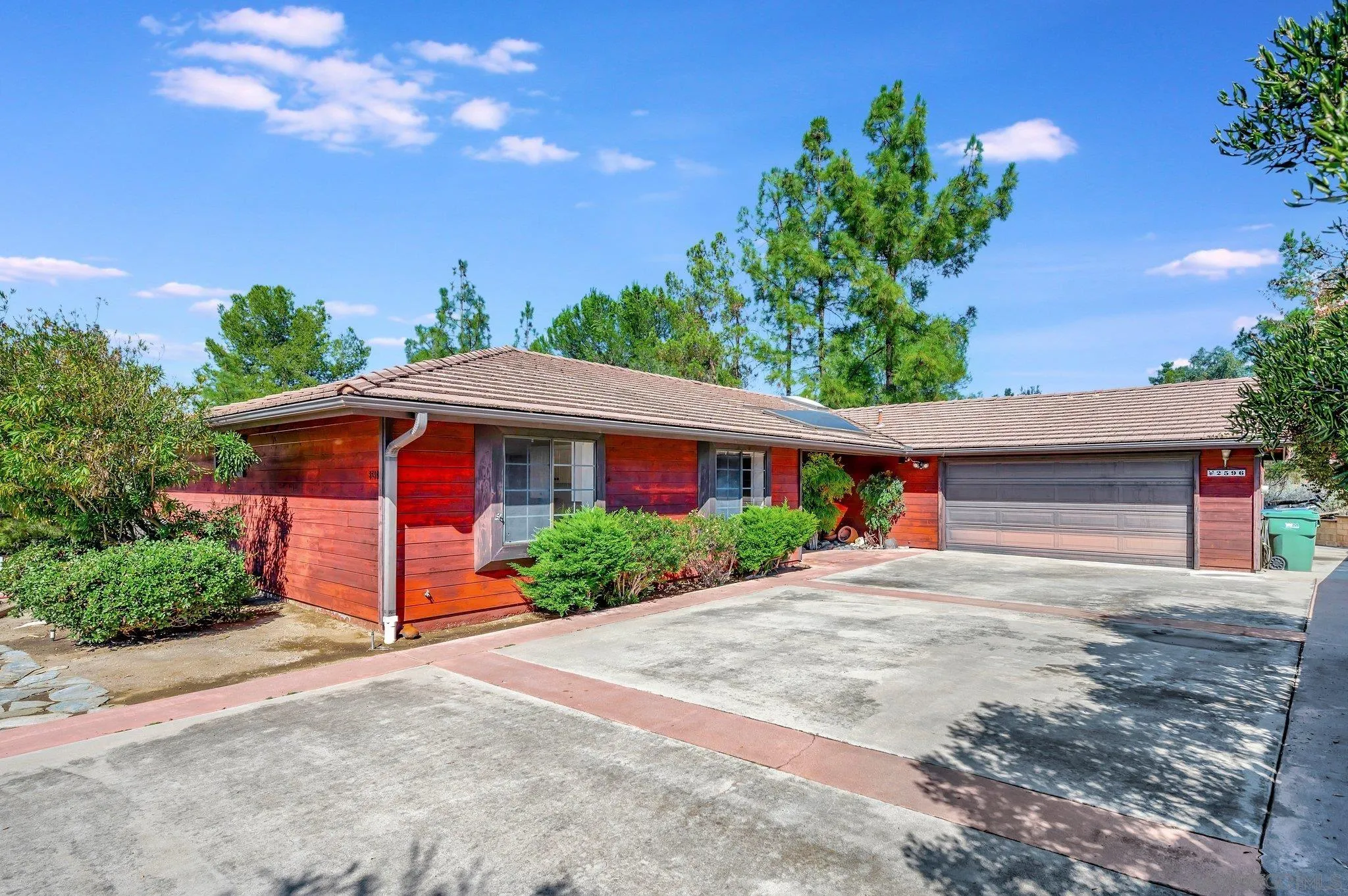2596 Valetta Lane Alpine, CA 91901 - Photo 5 of 48 a front view of a house with a yard and garage