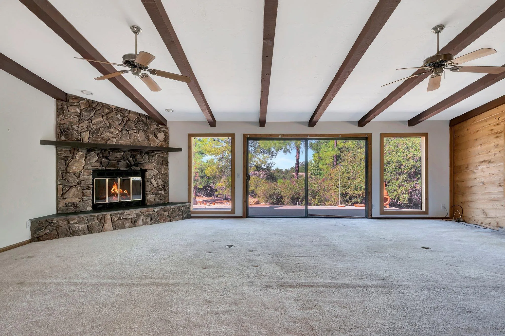 2596 Valetta Lane Alpine, CA 91901 - Photo 8 of 48 a view of an empty room with a fireplace and a window