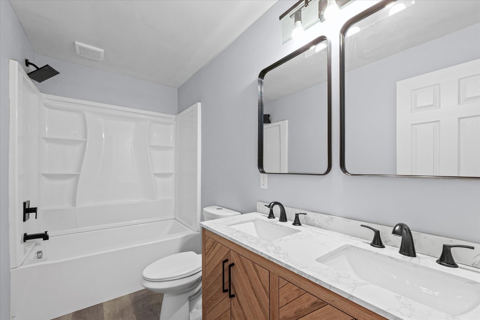 842 North Walnut Street Monticello, IL 61856 - Photo 14 of 33 a bathroom with a sink toilet tub and shower