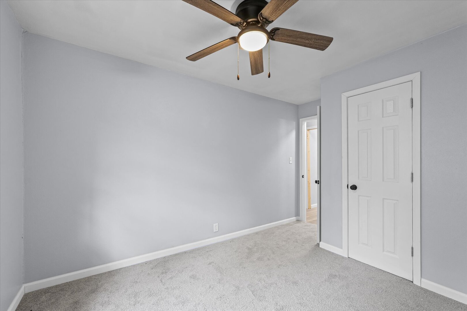 842 North Walnut Street Monticello, IL 61856 - Photo 23 of 33 an empty room with chandelier fan