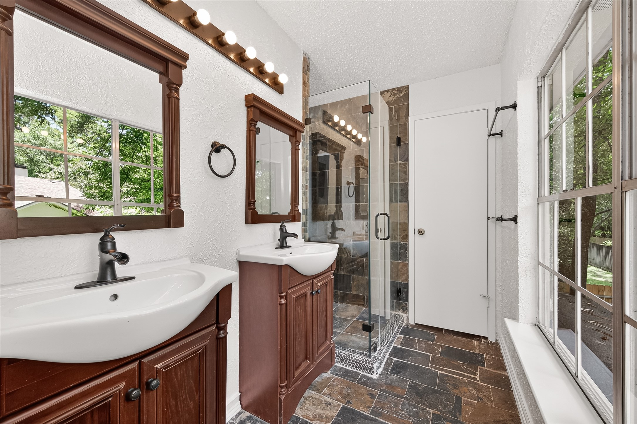 42 Rockridge Drive Spring, TX 77381 - Photo 22 of 39 Notice the double sinks and walk-in shower with glass surround.
