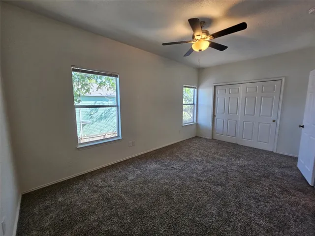 a bathroom with a sink a toilet and a large mirror