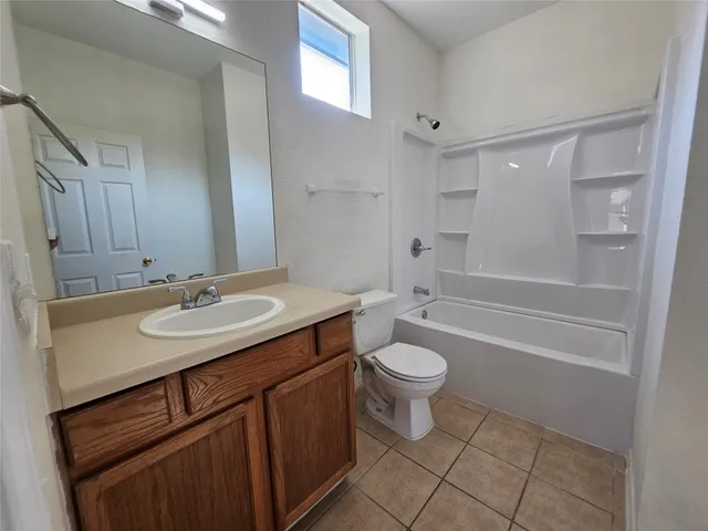 a view of a livingroom with a chandelier fan