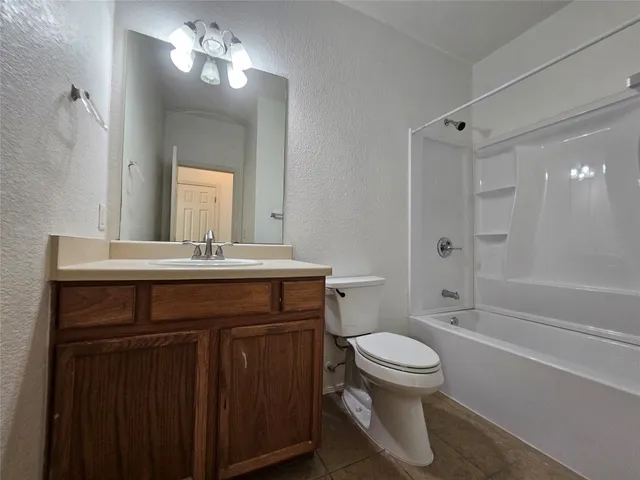 a view of an empty room with wooden walls