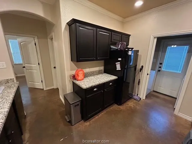 a living room with hard wood flooring and a fireplace