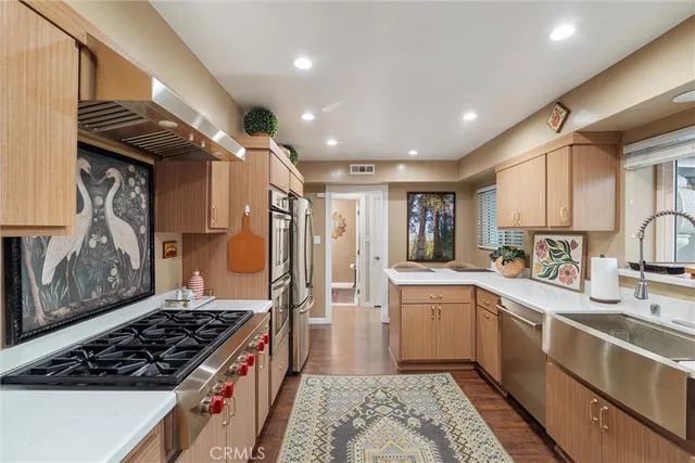 a kitchen with a stove and a sink