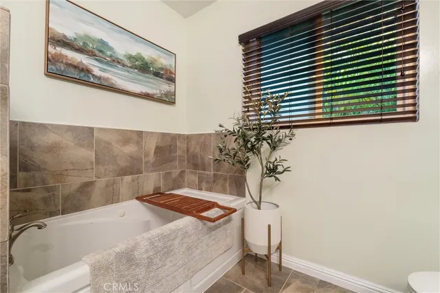 a bathroom with a bathtub and shower