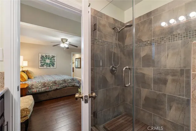 a bedroom with a bed and a shower