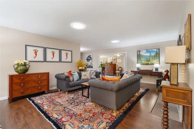 a living room with furniture rug and window