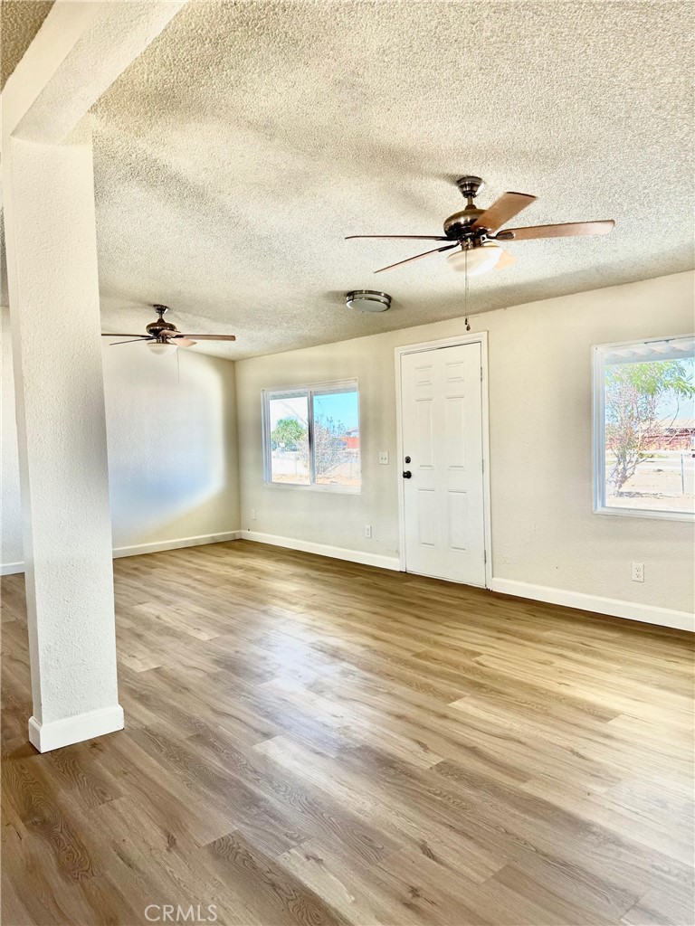 12782 Atsina Road Phelan, CA 92371 - Photo 4 of 18 wooden floor in an empty room