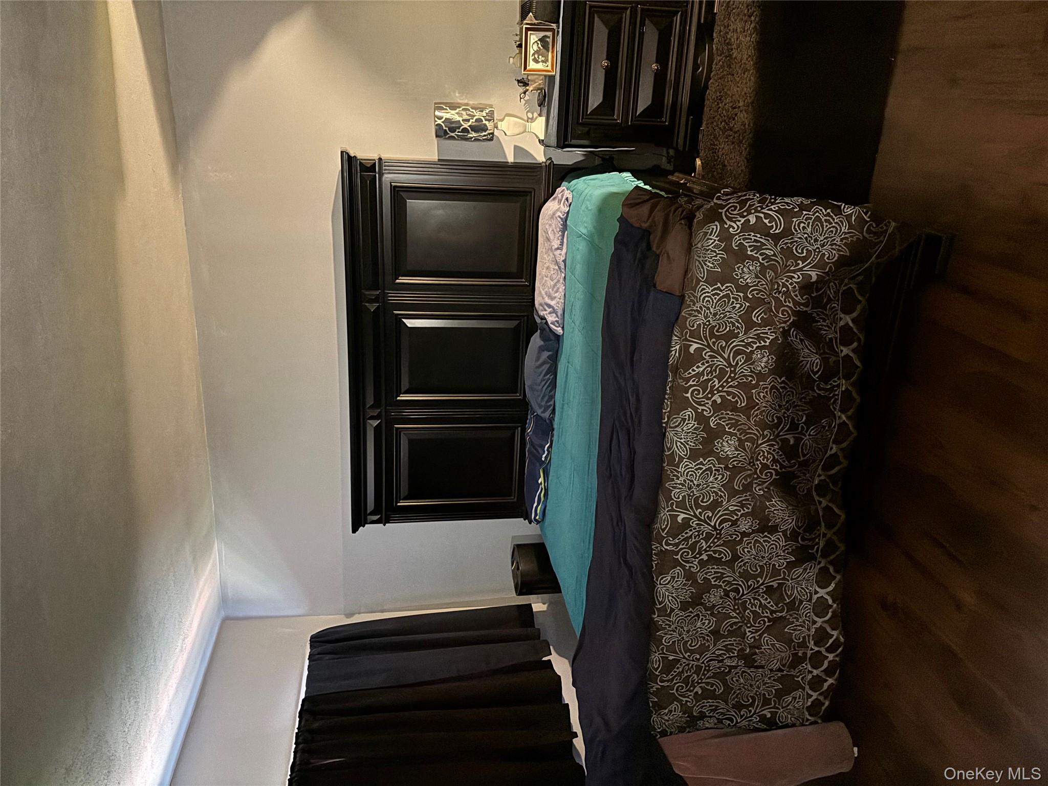 59 Windmill Road Hyde Park, NY 12601 - Photo 9 of 13 Bedroom with dark wood-style floors and a textured ceiling