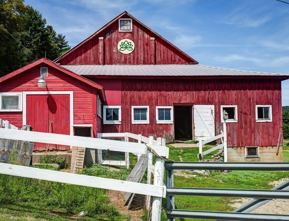 210 Wheeler Avenue Orange, MA 01364 - Photo 5 of 14 a front view of a house with garden