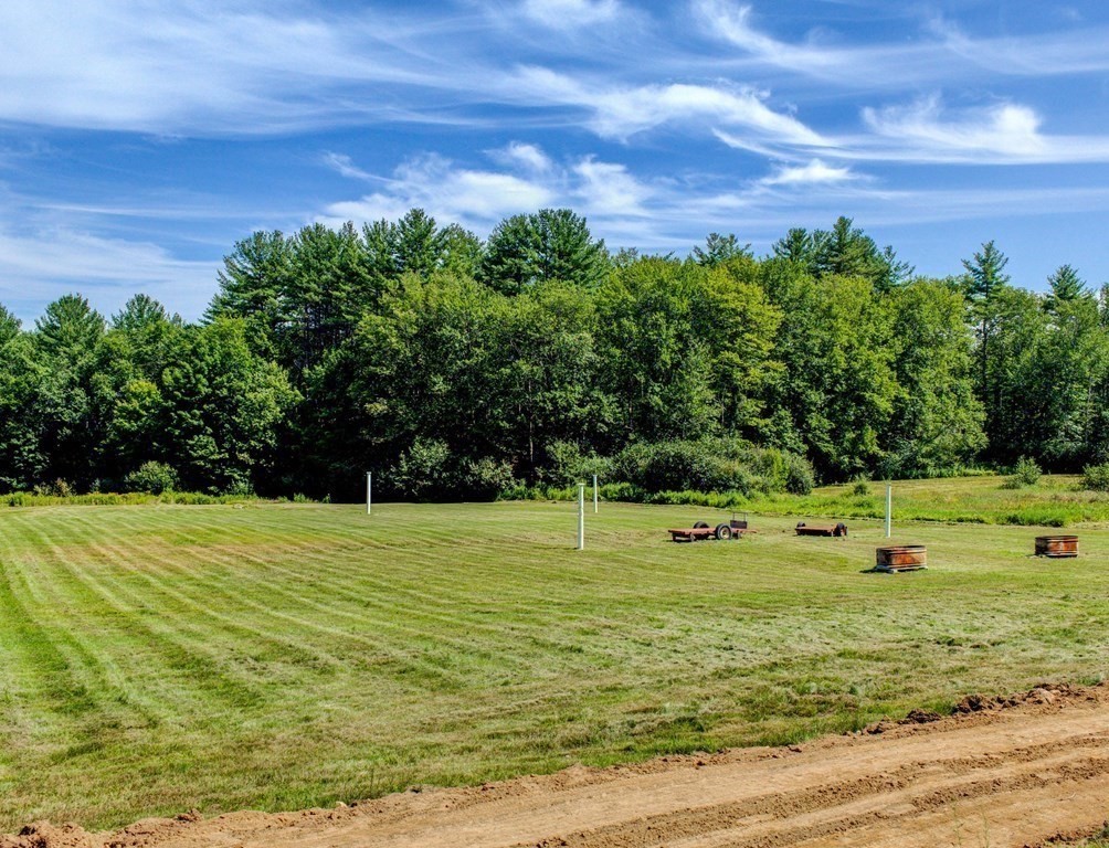 210 Wheeler Avenue Orange, MA 01364 - Photo 8 of 14 a view of a golf course with a house