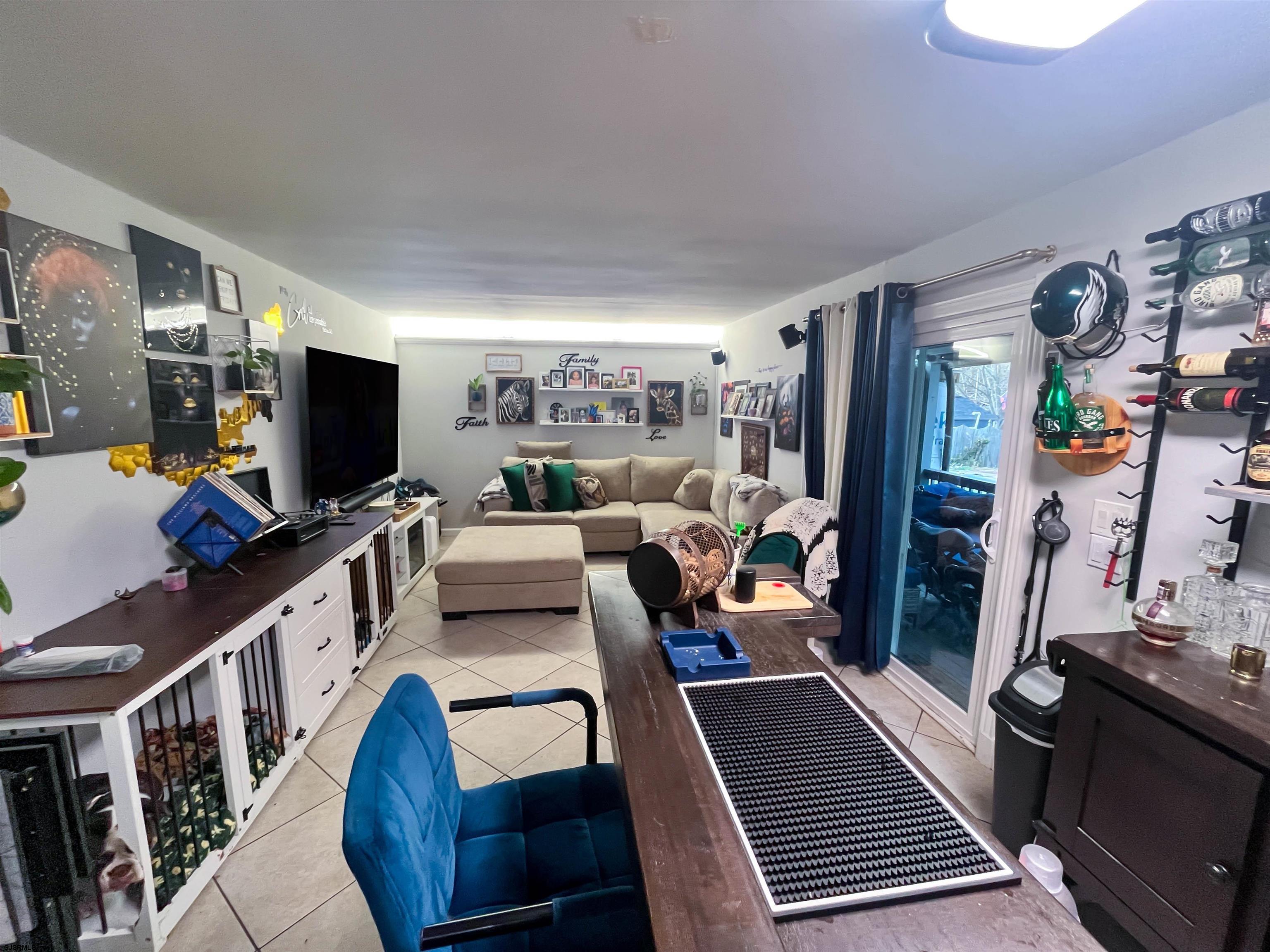 522 Zion Road Egg Harbor Township, NJ 08234 - Photo 11 of 42 a living room with furniture and a flat screen tv