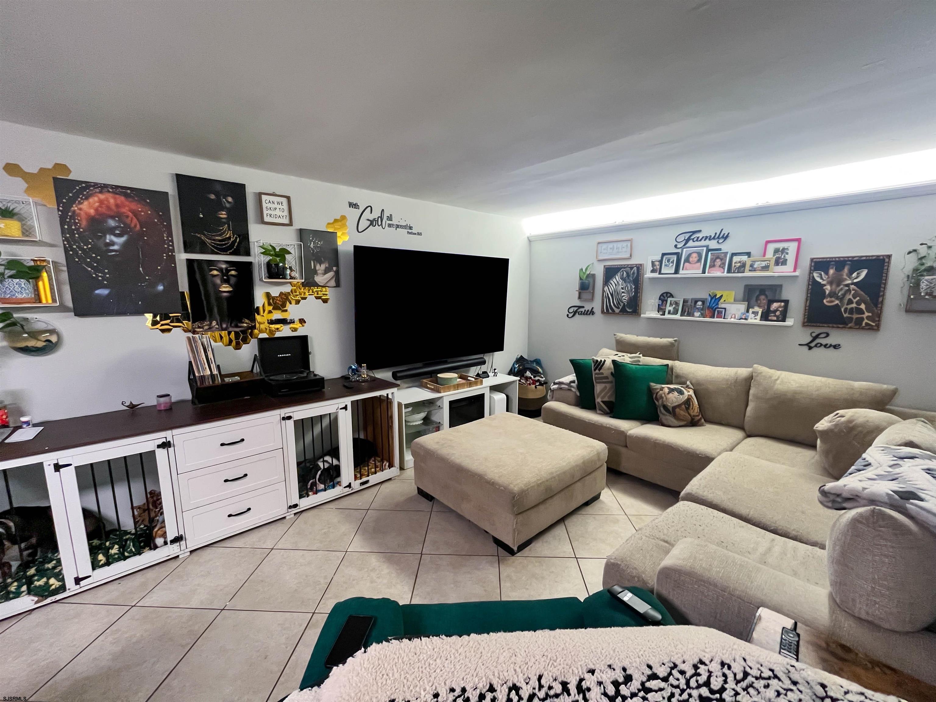 522 Zion Road Egg Harbor Township, NJ 08234 - Photo 12 of 42 a living room with furniture and a flat screen tv