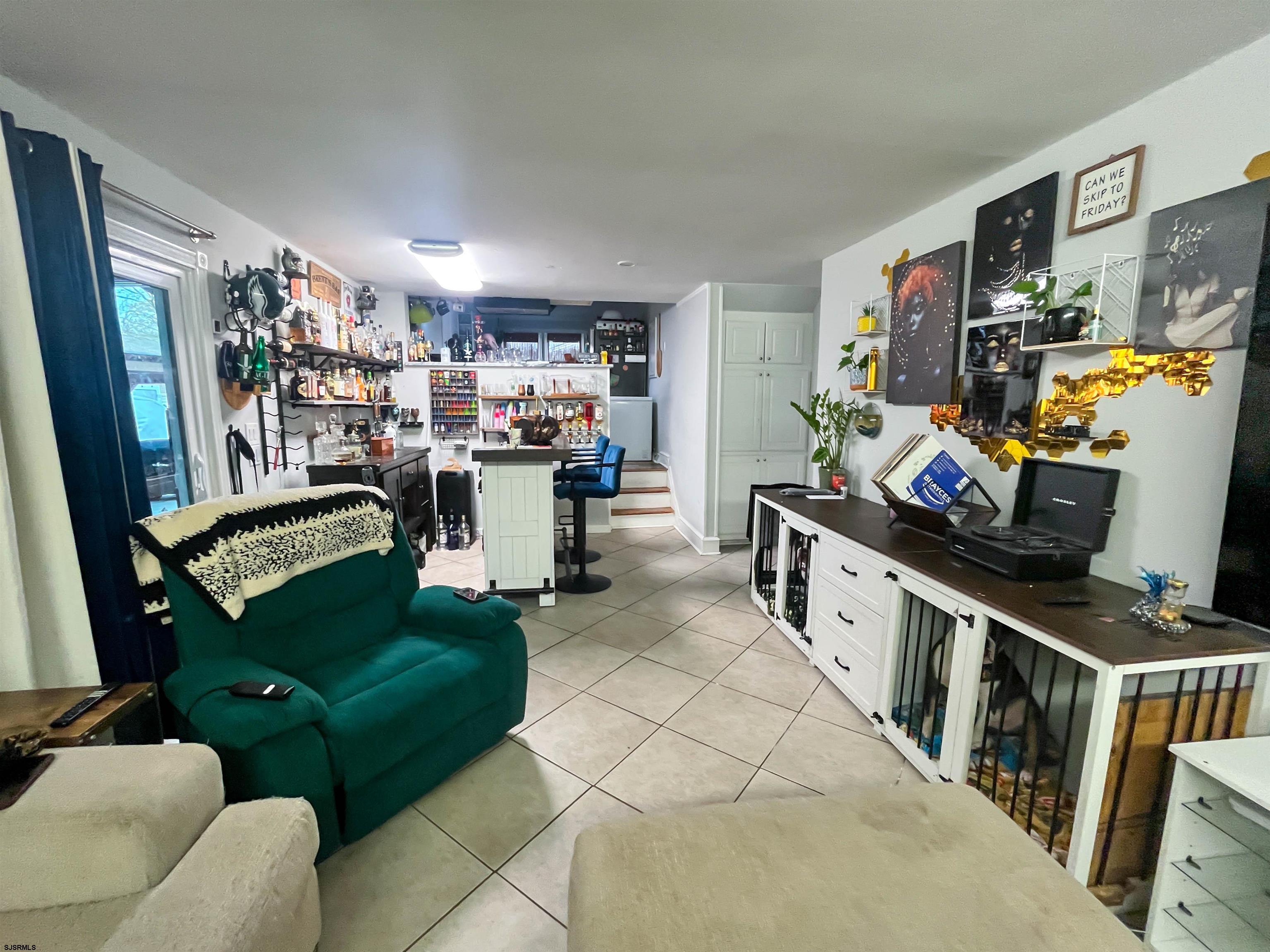 522 Zion Road Egg Harbor Township, NJ 08234 - Photo 13 of 42 a living room with furniture and a flat screen tv