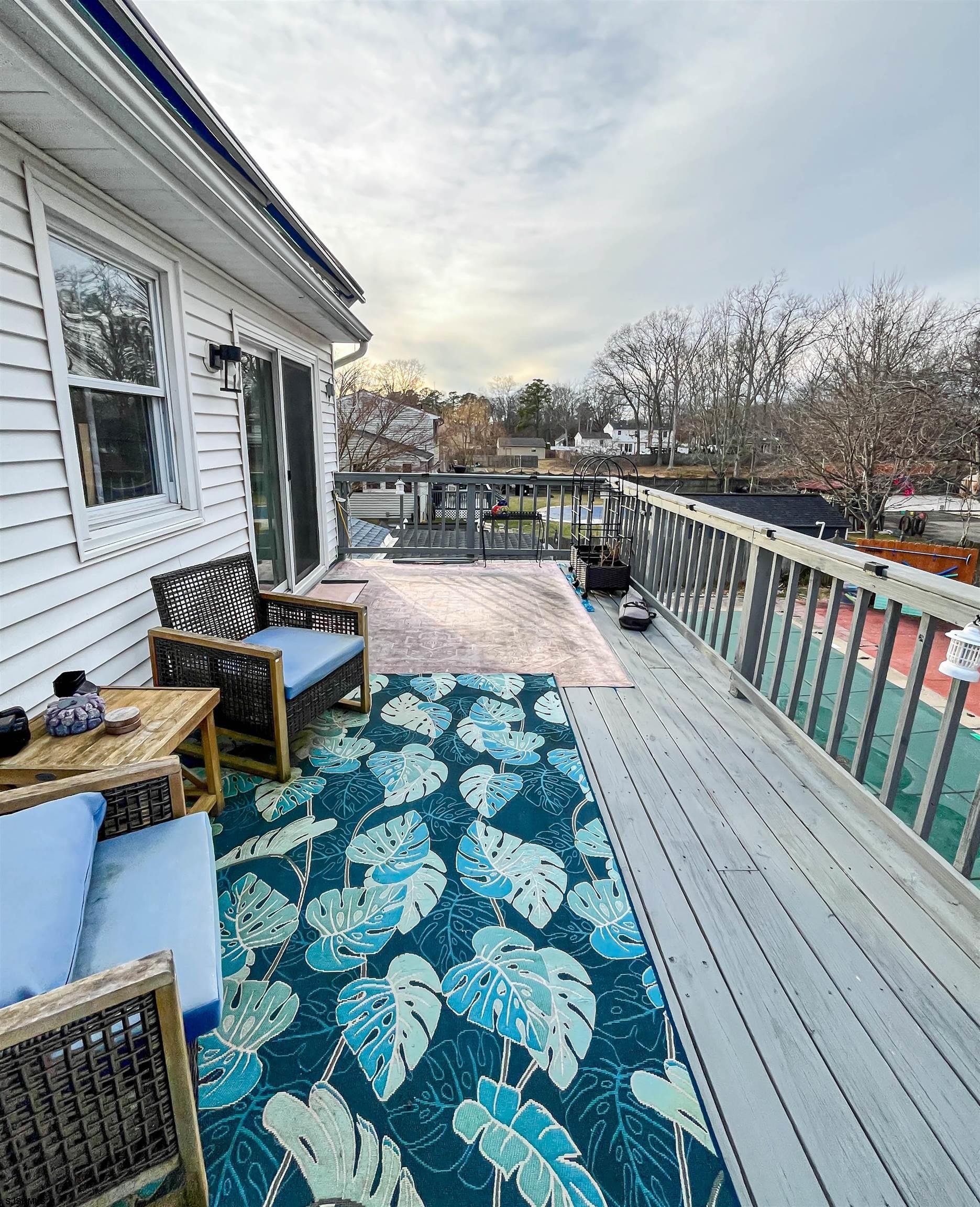 522 Zion Road Egg Harbor Township, NJ 08234 - Photo 17 of 42 a balcony with wooden floor and outdoor seating