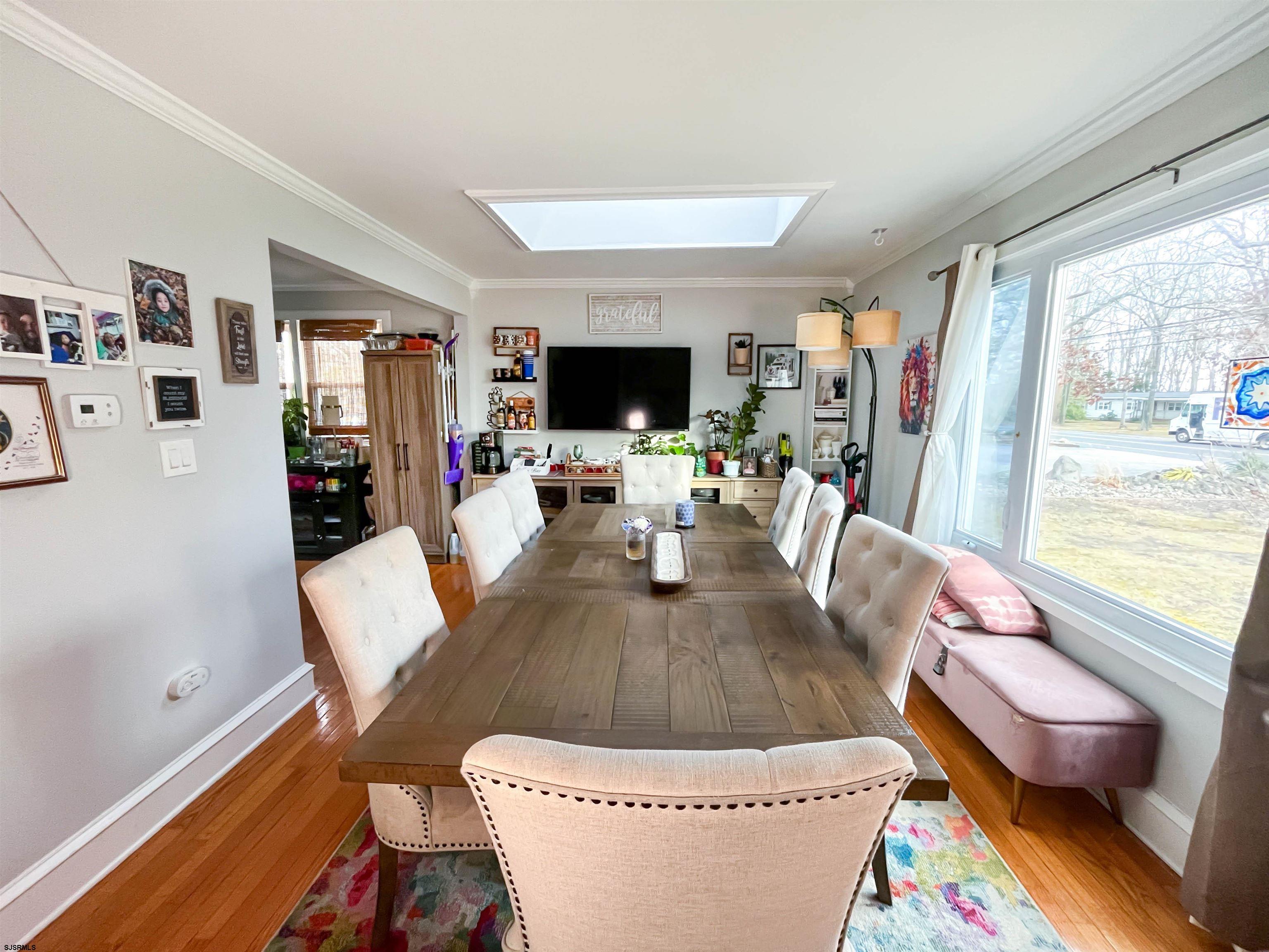 522 Zion Road Egg Harbor Township, NJ 08234 - Photo 2 of 42 a living room with furniture and a flat screen tv