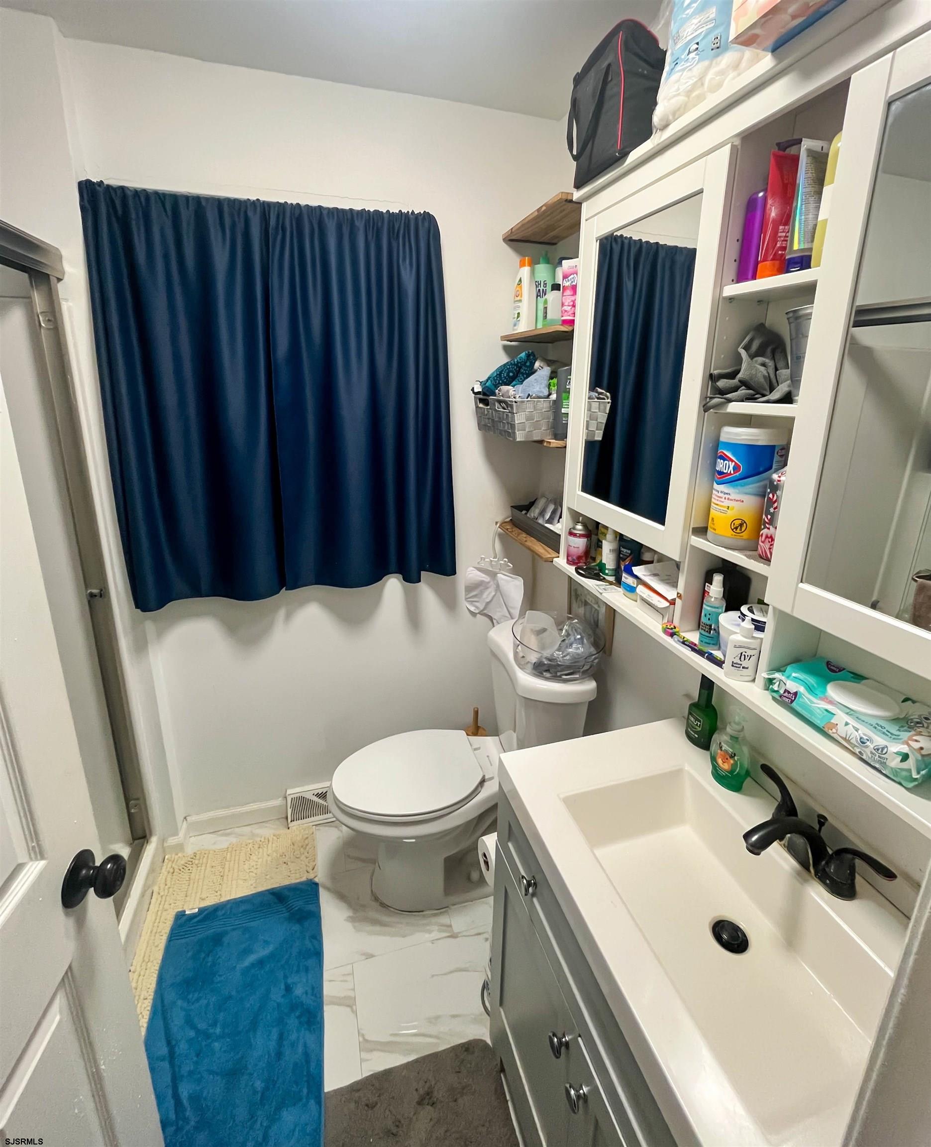 522 Zion Road Egg Harbor Township, NJ 08234 - Photo 26 of 42 a bathroom with a sink toilet and shower