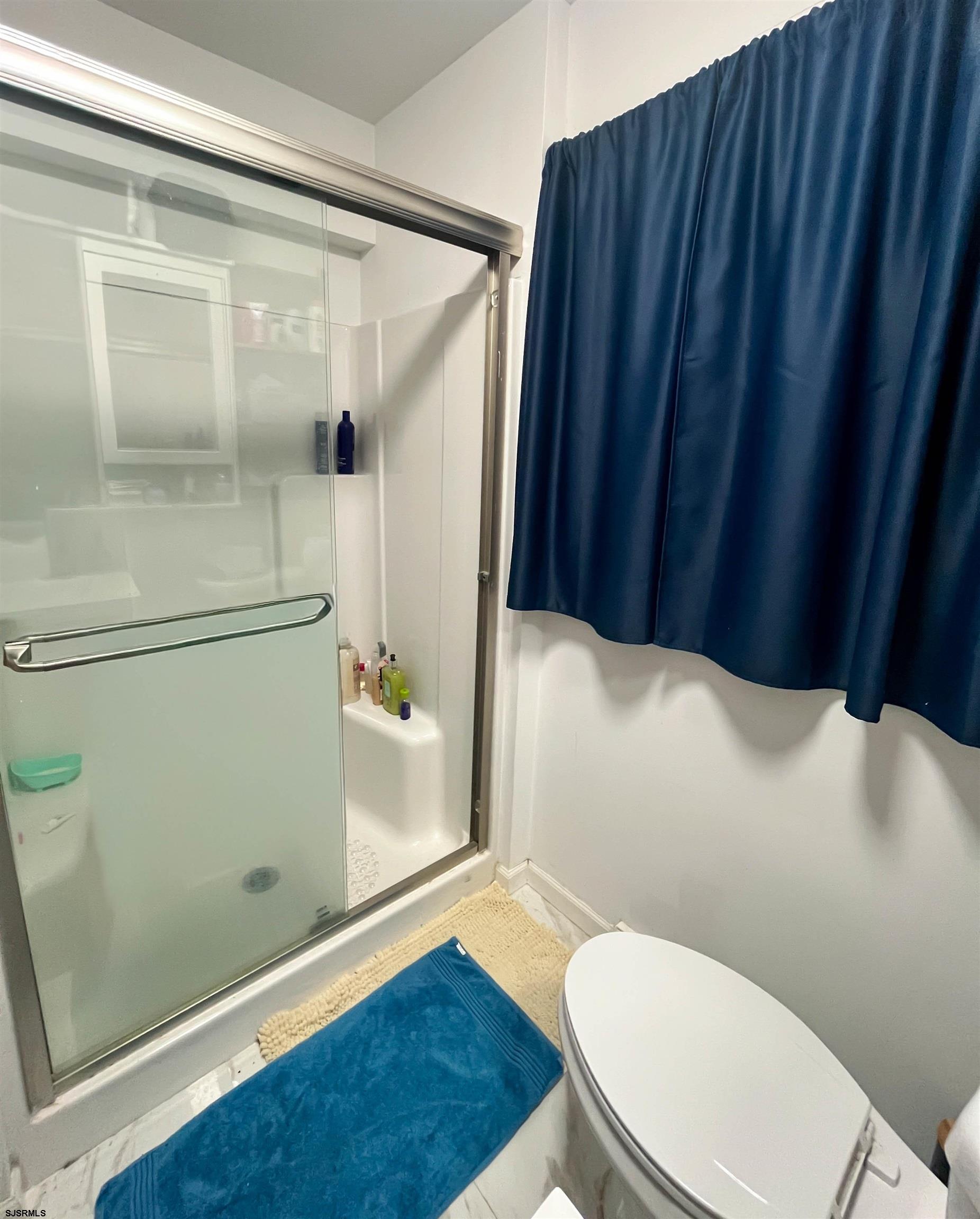 522 Zion Road Egg Harbor Township, NJ 08234 - Photo 27 of 42 a white toilet sitting next to a bathroom sink