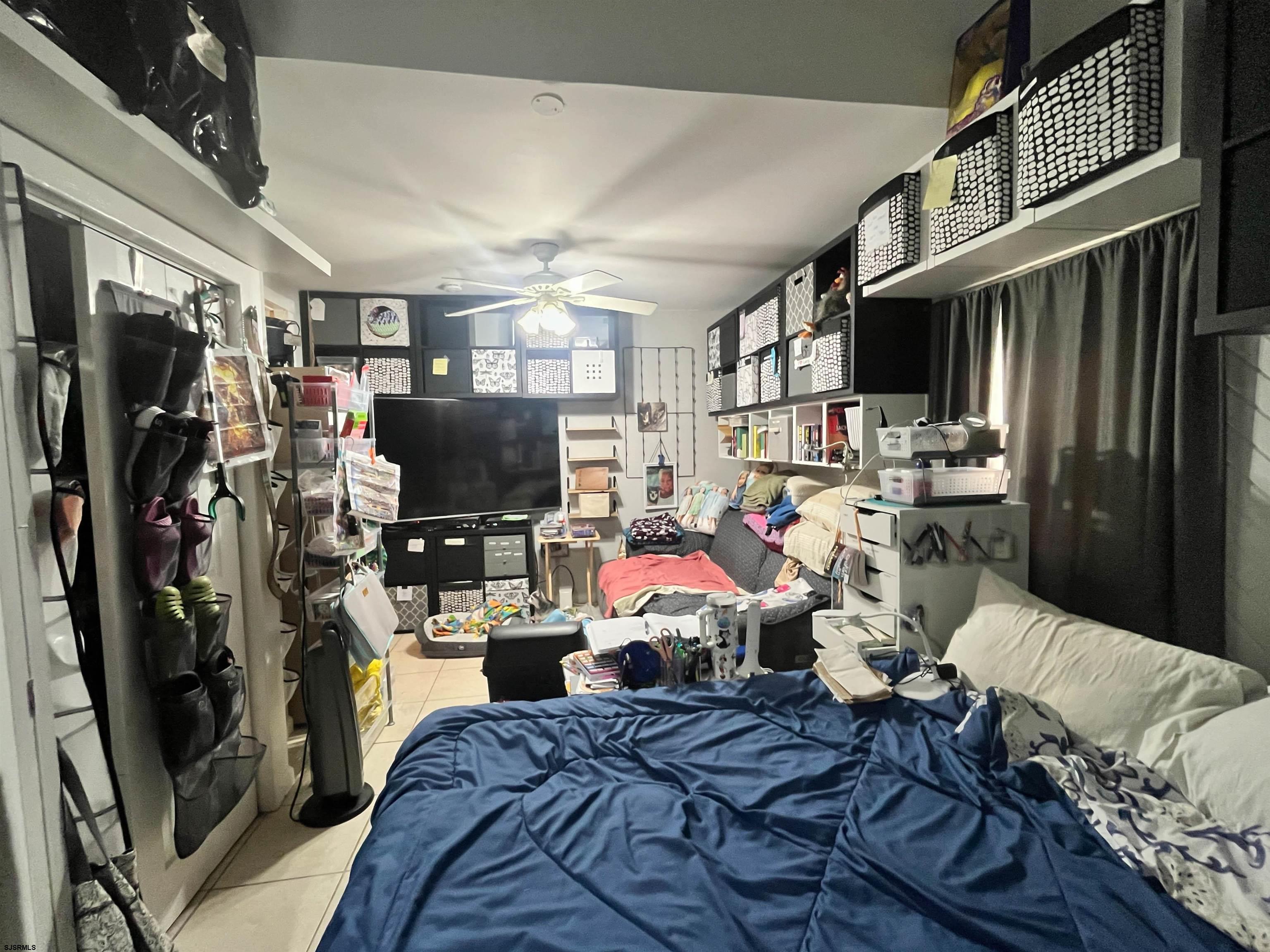 522 Zion Road Egg Harbor Township, NJ 08234 - Photo 29 of 42 a living room with lots of furniture and a flat screen tv