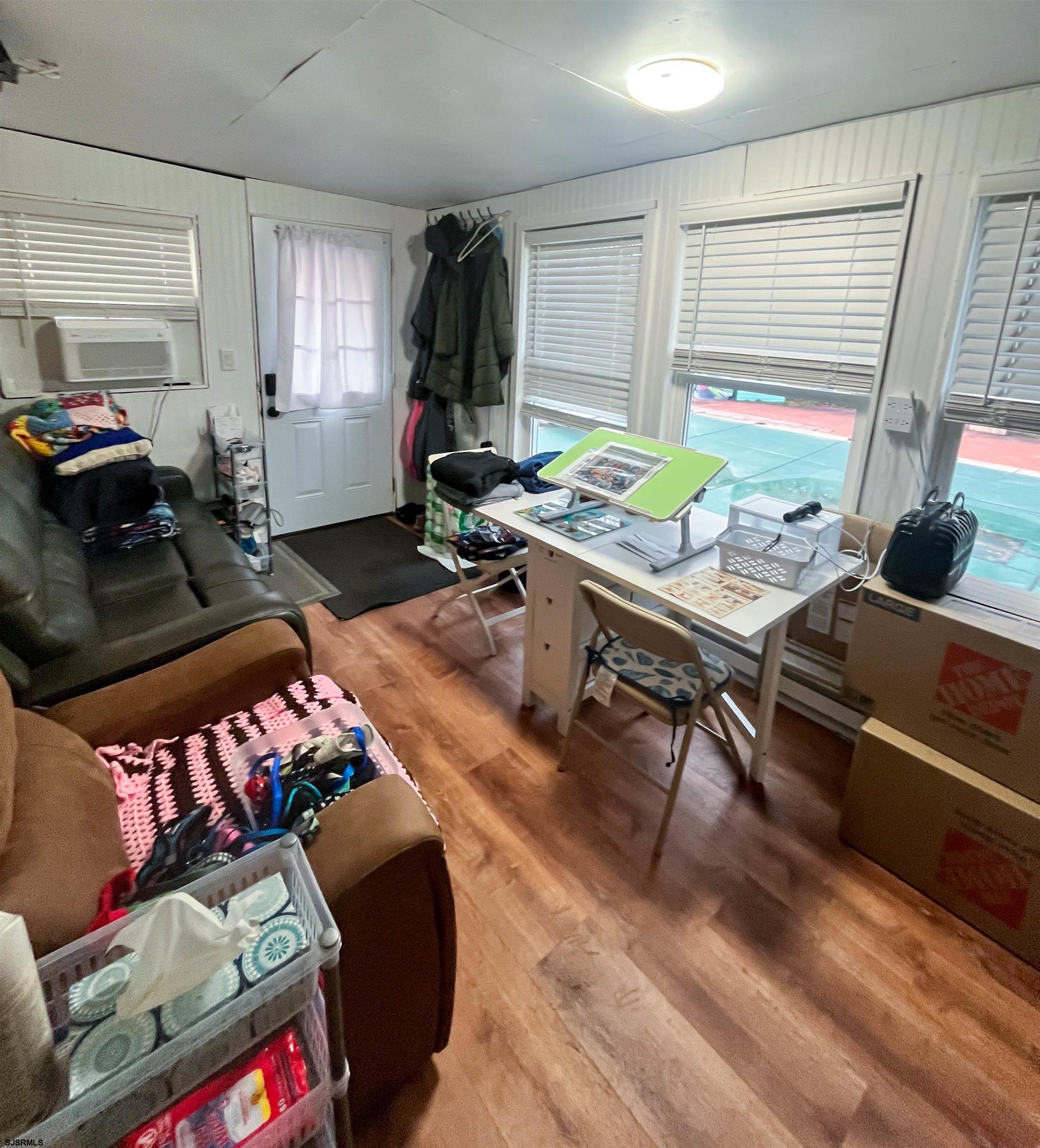 522 Zion Road Egg Harbor Township, NJ 08234 - Photo 30 of 42 a living room with furniture and a wooden floor