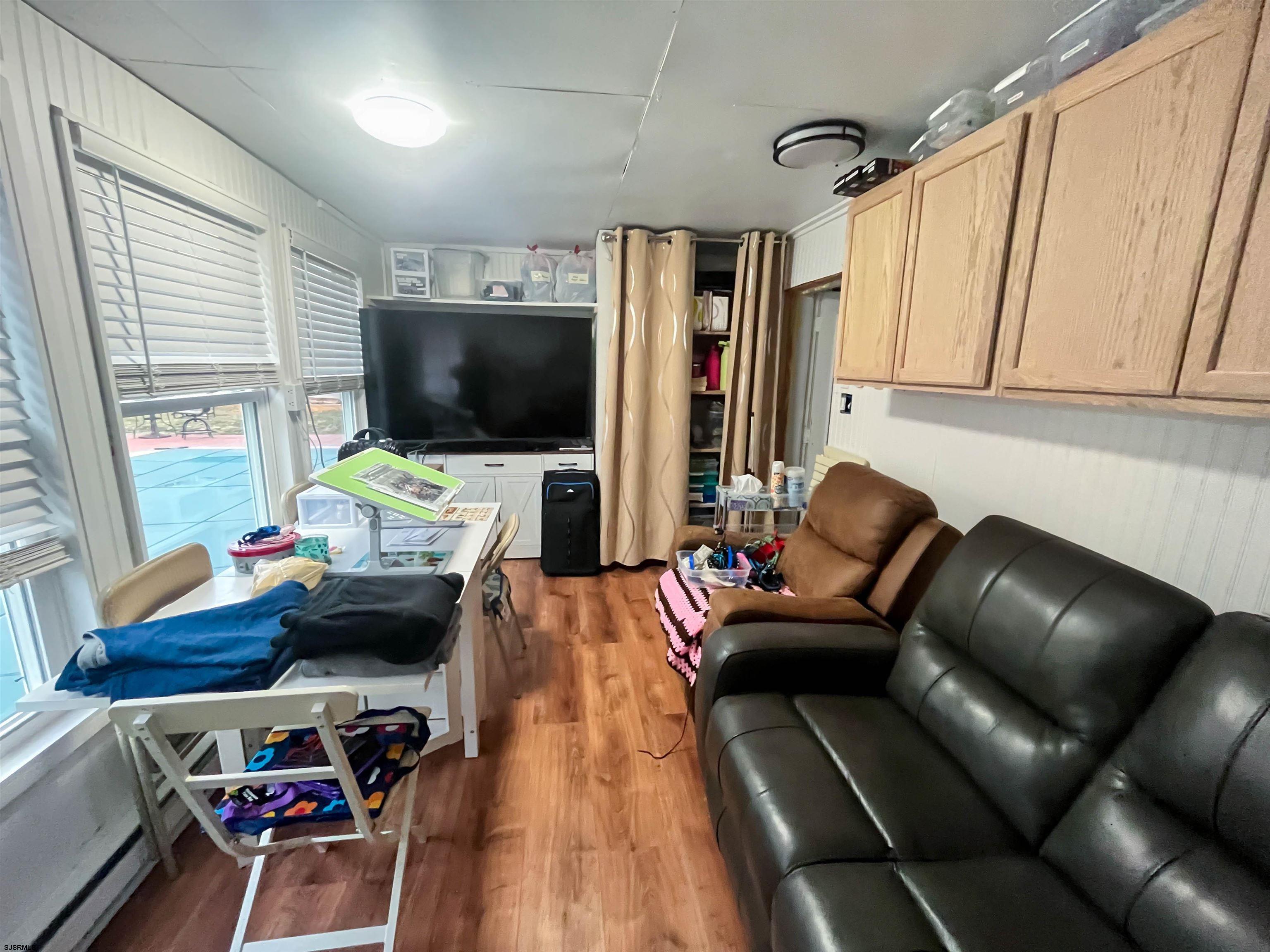522 Zion Road Egg Harbor Township, NJ 08234 - Photo 31 of 42 a living room with furniture and a flat screen tv