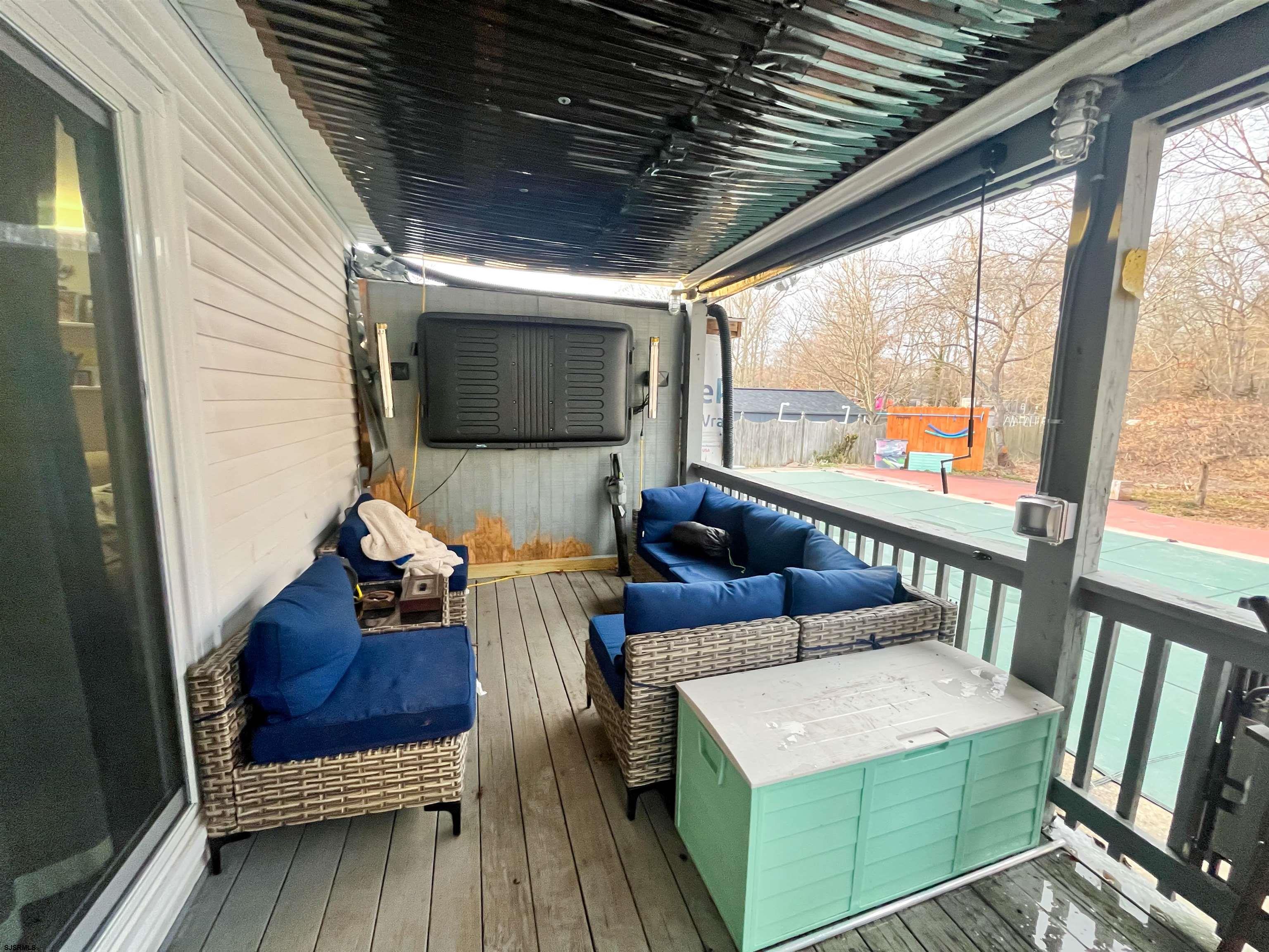 522 Zion Road Egg Harbor Township, NJ 08234 - Photo 34 of 42 a living room with furniture and a flat screen tv