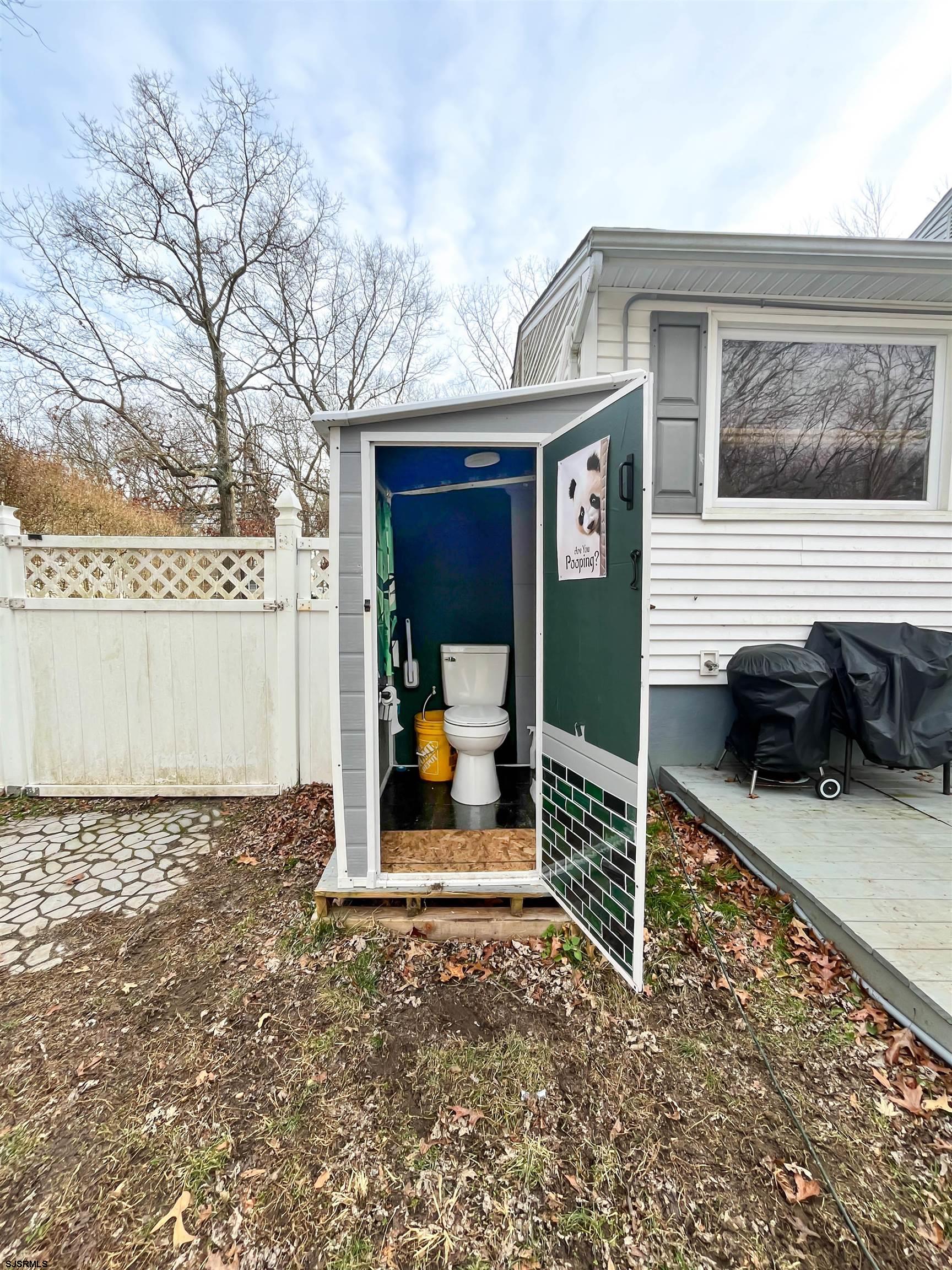 522 Zion Road Egg Harbor Township, NJ 08234 - Photo 37 of 42 a front view of a house with a large window and table