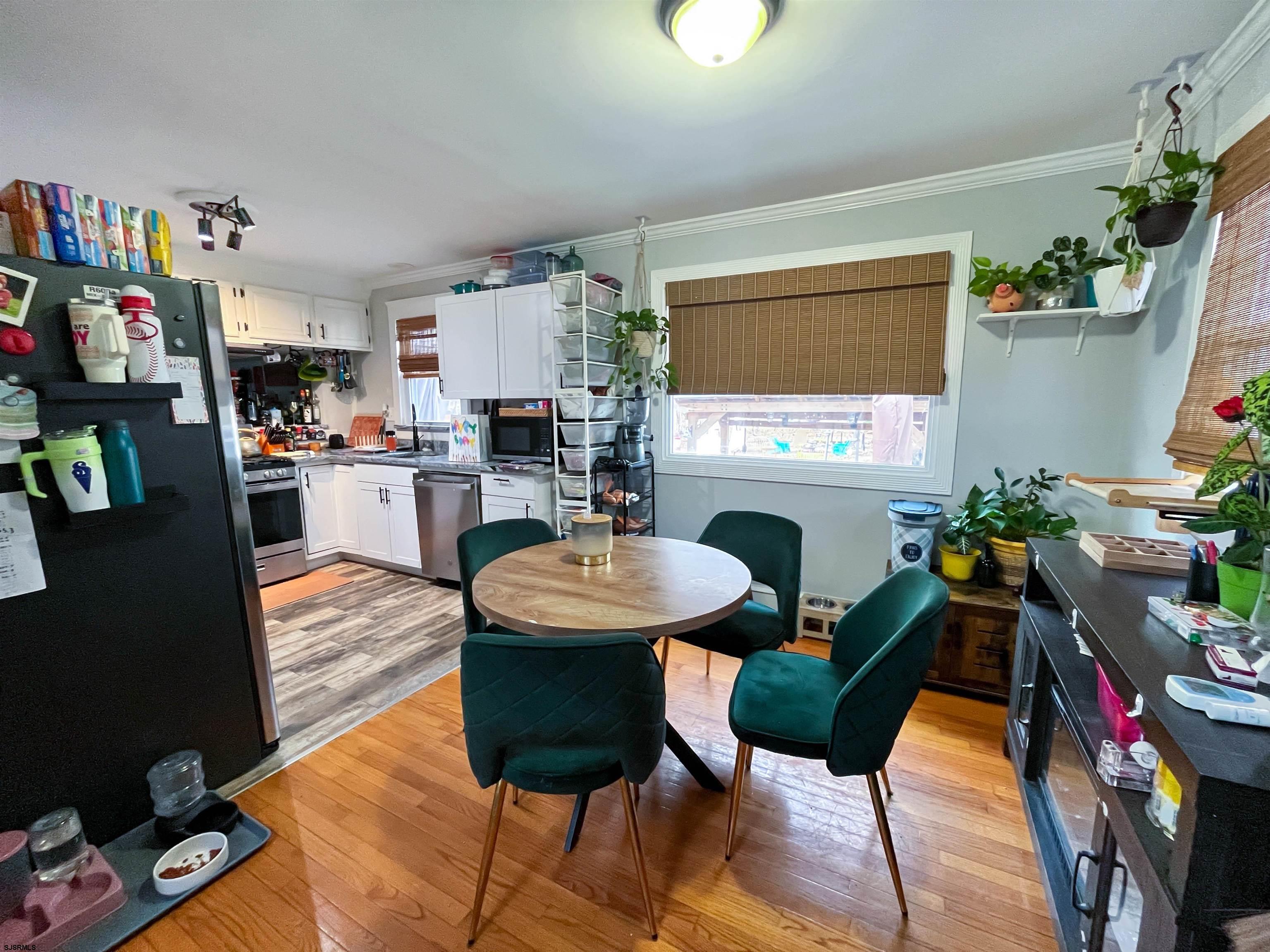522 Zion Road Egg Harbor Township, NJ 08234 - Photo 7 of 42 a living room with furniture a fireplace and a flat screen tv