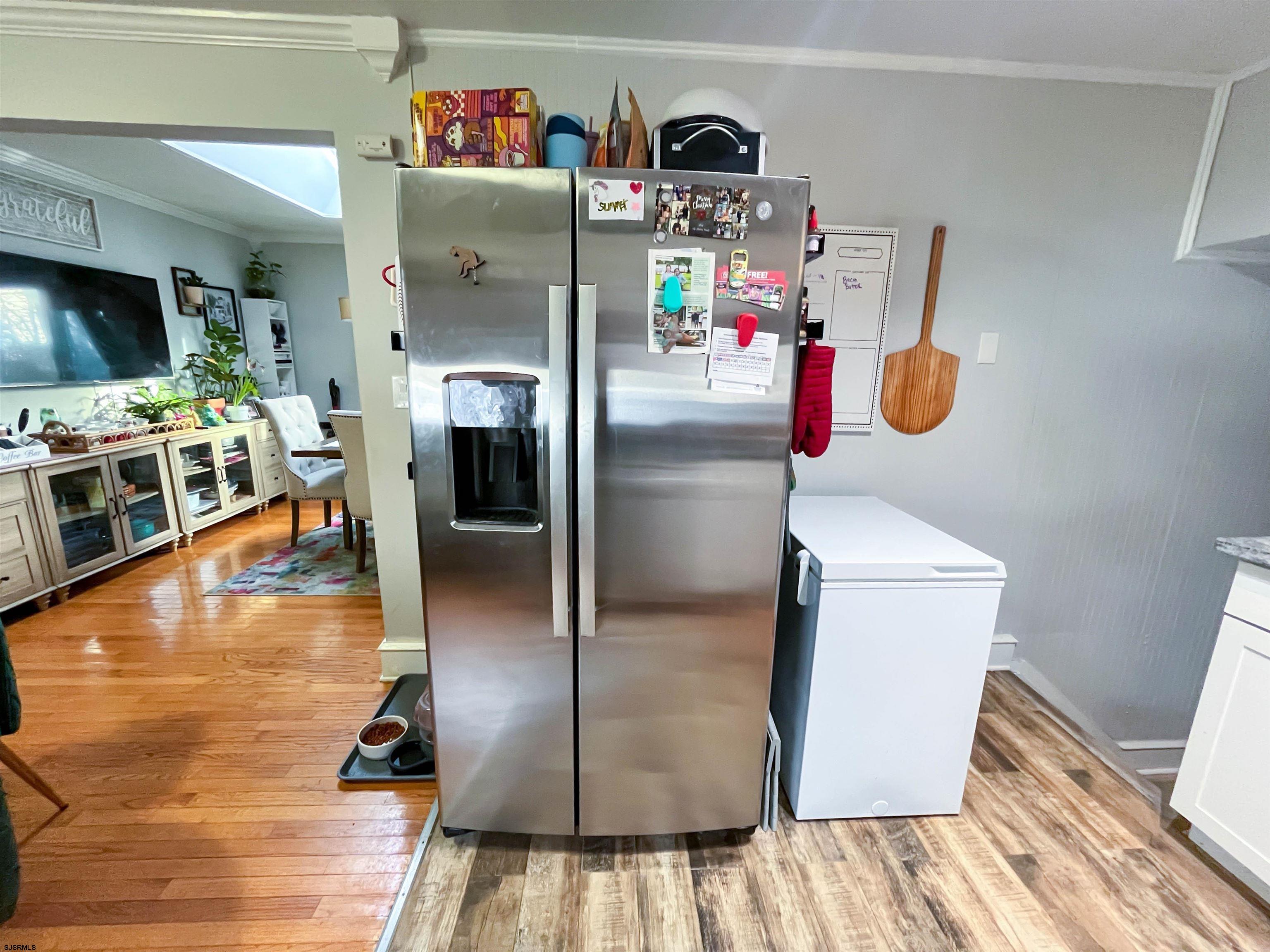 522 Zion Road Egg Harbor Township, NJ 08234 - Photo 10 of 42 a kitchen with a refrigerator and a flat screen tv