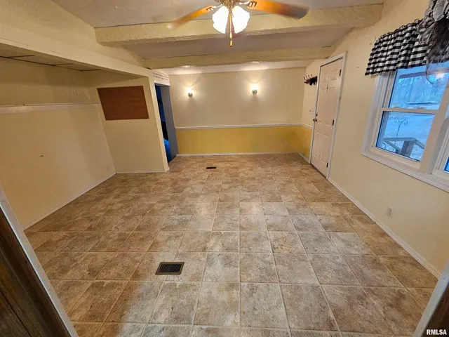 a kitchen with stainless steel appliances a stove a refrigerator a sink and a microwave