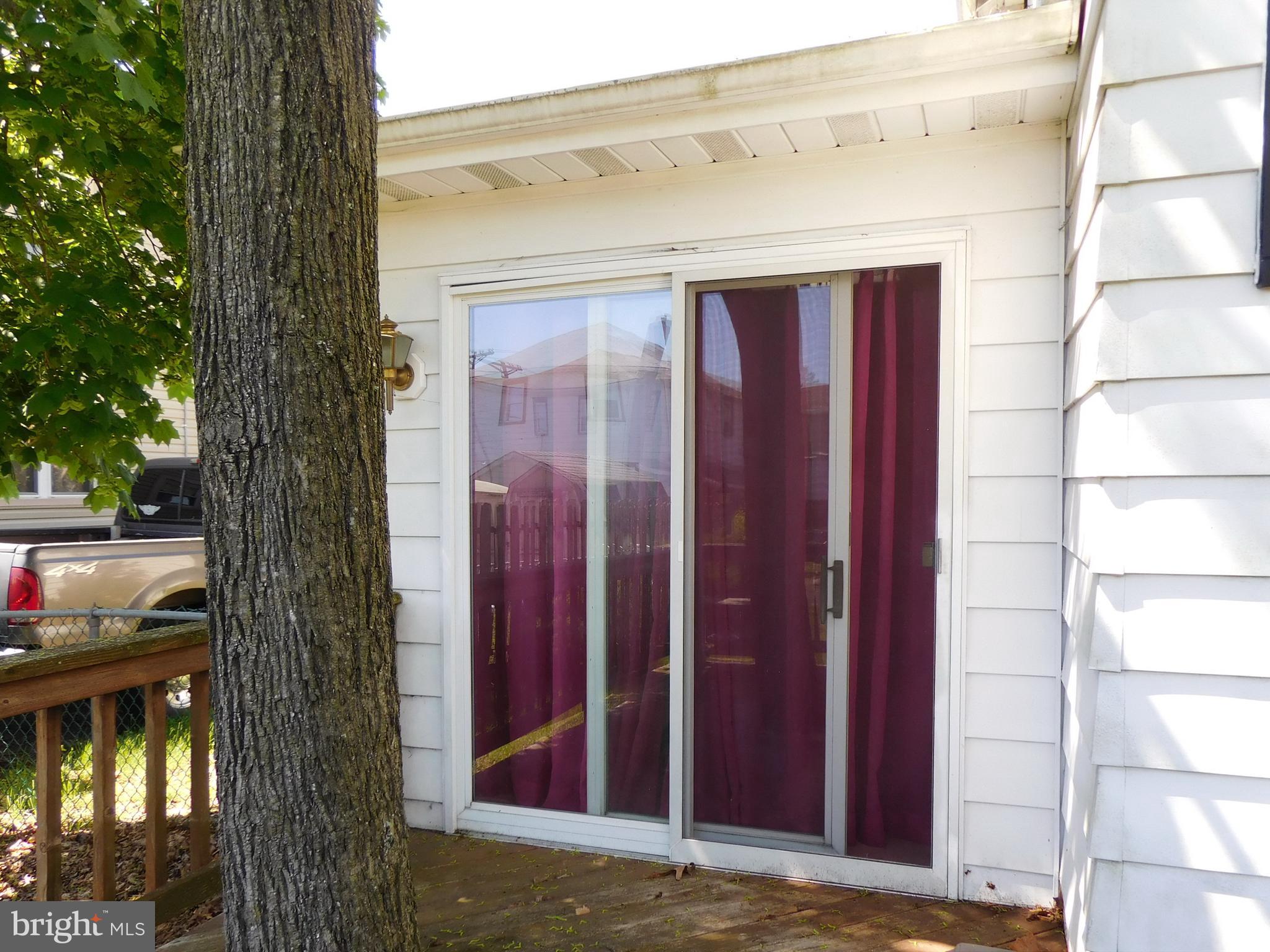 511 Heulings Avenue Riverside, NJ 08075 - Photo 13 of 39 rear deck with sliding doors