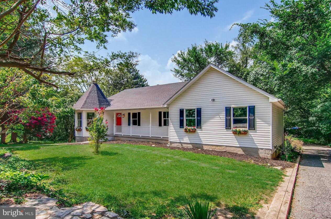 1606 Frederick Road Baltimore, MD 21228 - Photo 2 of 28 a front view of house with yard and green space