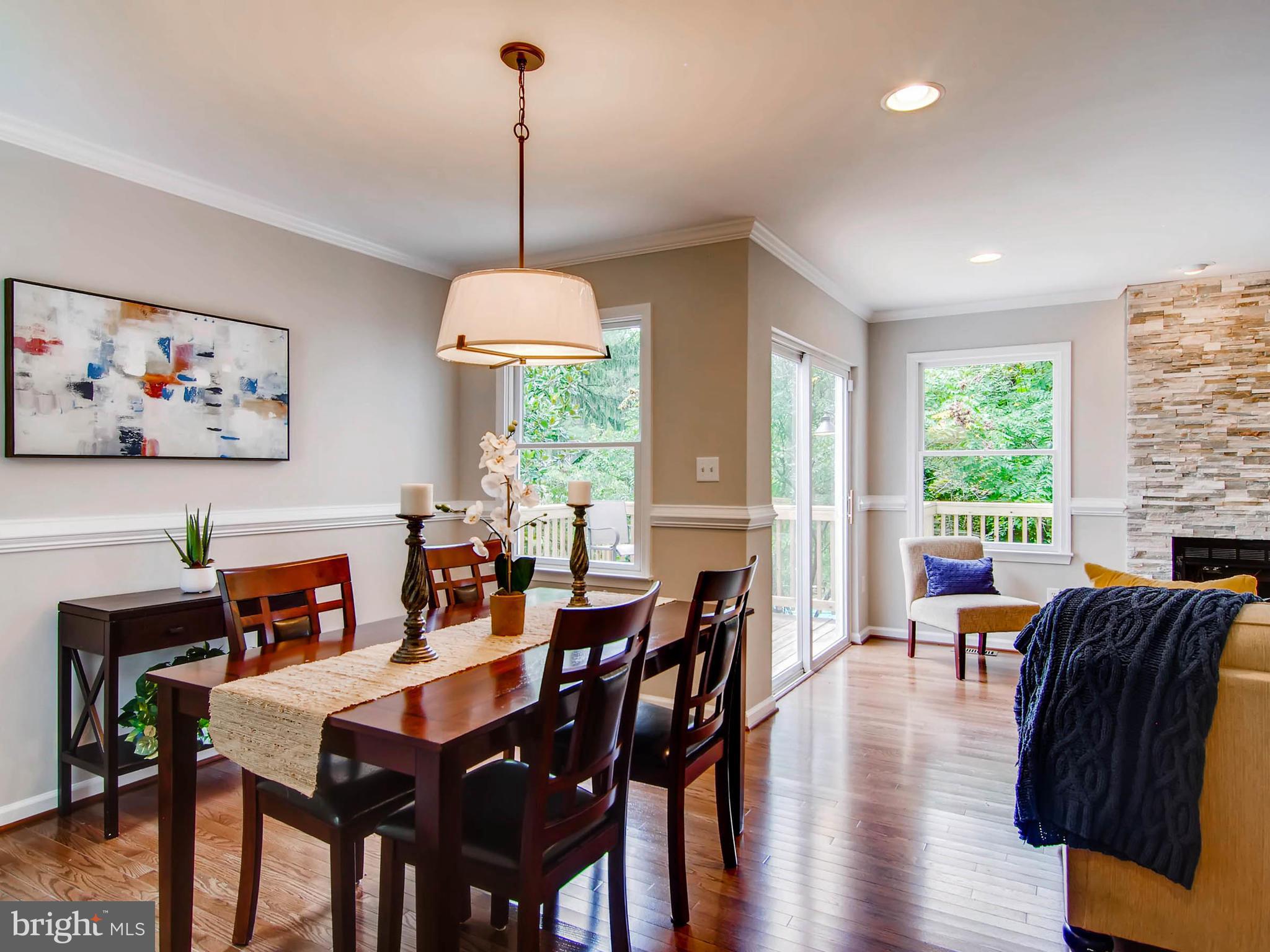 1606 Frederick Road Baltimore, MD 21228 - Photo 12 of 28 a view of a dining room with furniture window and wooden floor