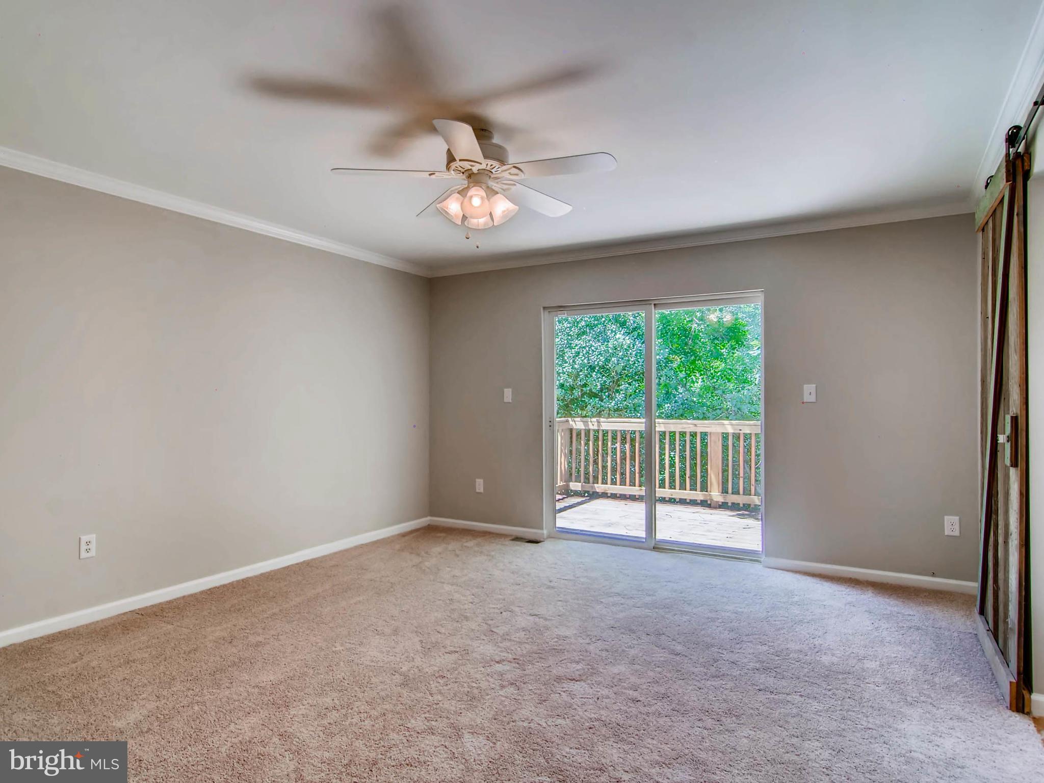 1606 Frederick Road Baltimore, MD 21228 - Photo 13 of 28 a view of an empty room with a window