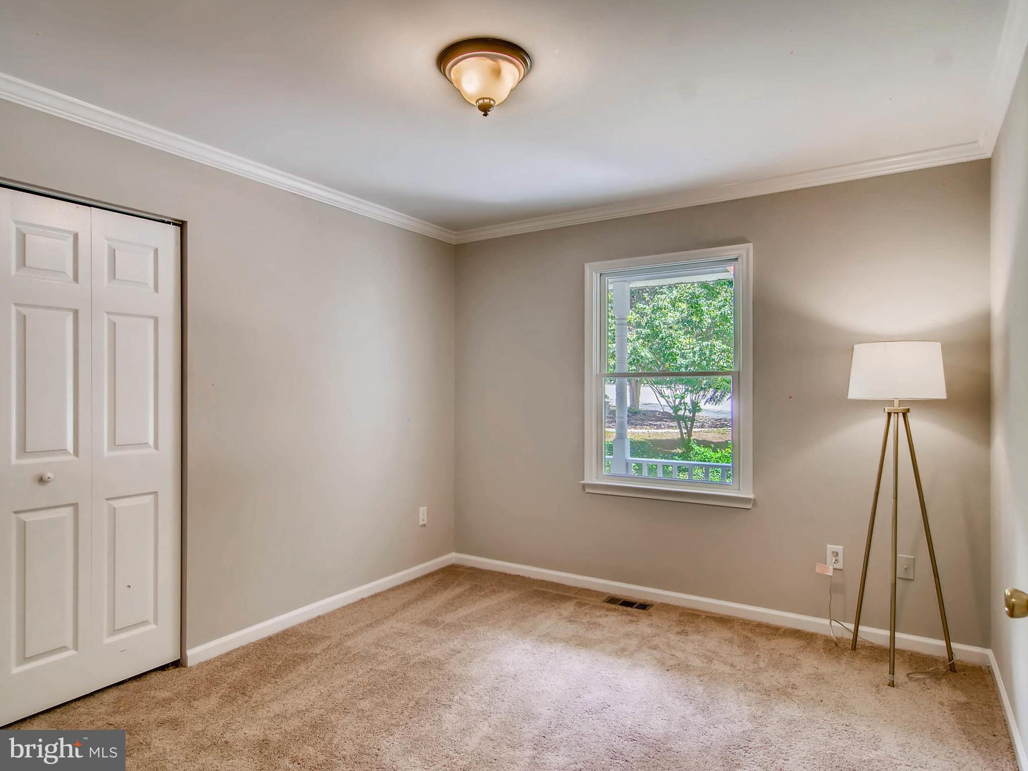 1606 Frederick Road Baltimore, MD 21228 - Photo 17 of 28 a view of an empty room with a window