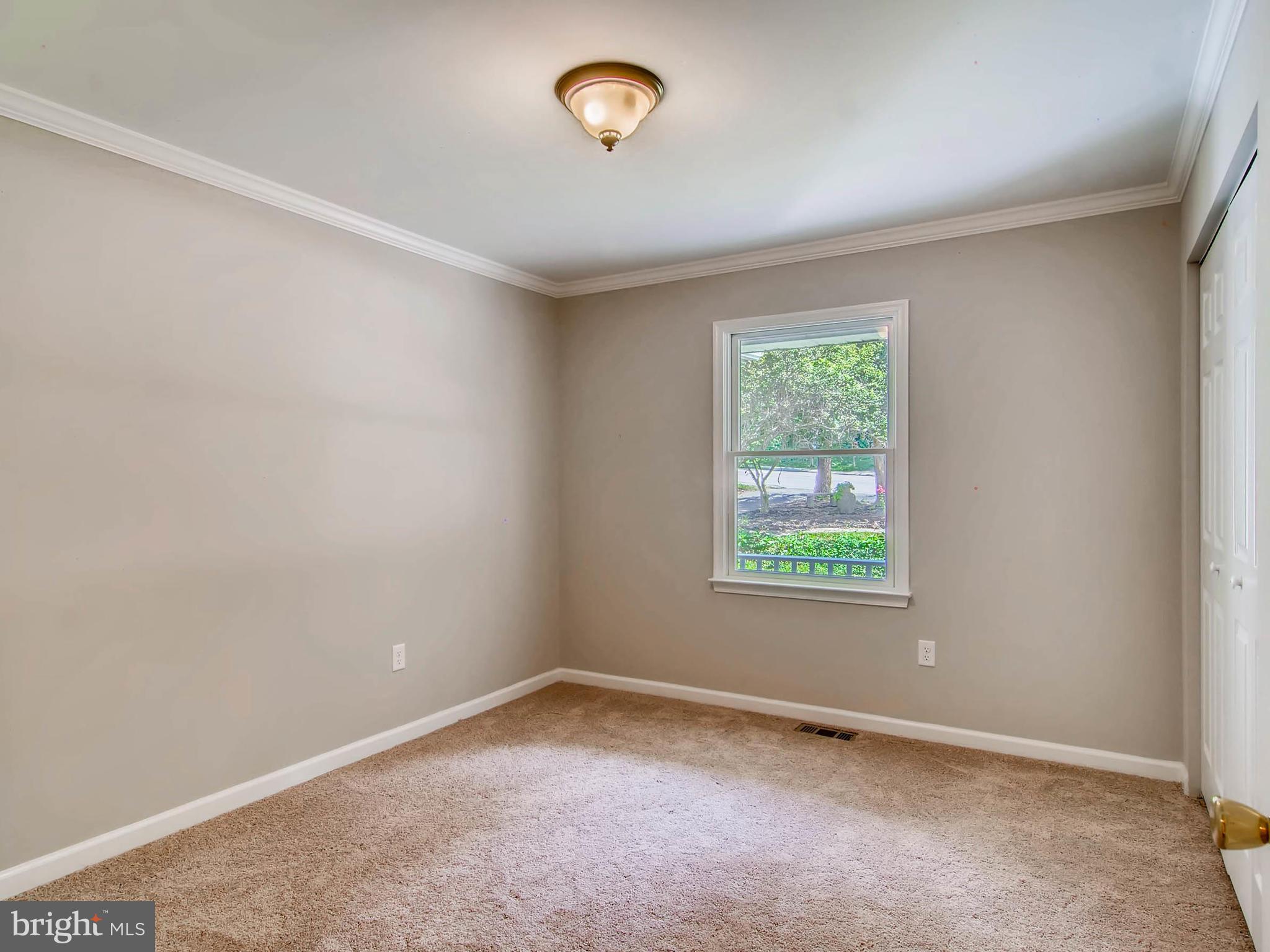1606 Frederick Road Baltimore, MD 21228 - Photo 18 of 28 an empty room with a window