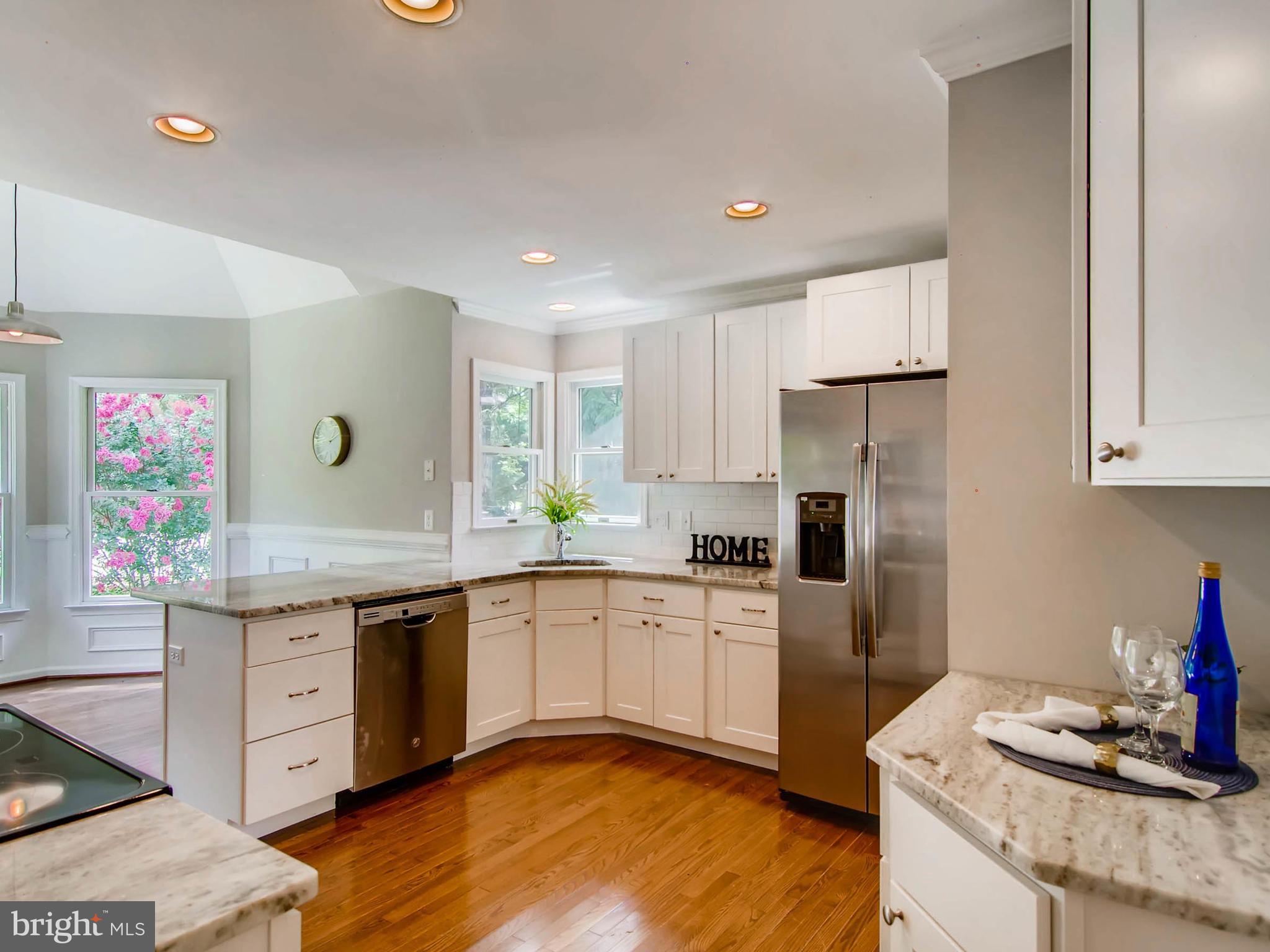 1606 Frederick Road Baltimore, MD 21228 - Photo 5 of 28 a kitchen with a sink stove and refrigerator
