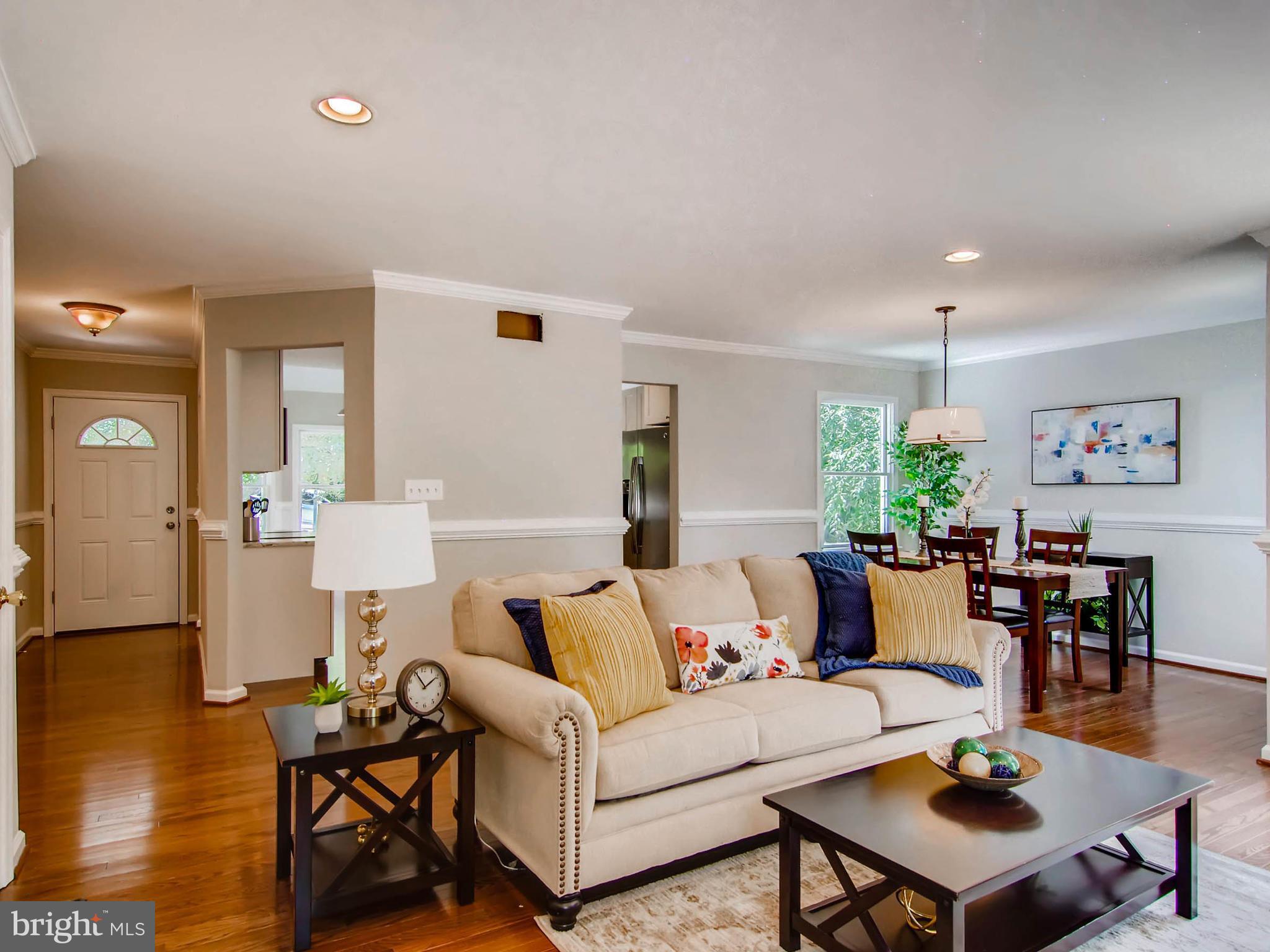 1606 Frederick Road Baltimore, MD 21228 - Photo 10 of 28 a living room with furniture and wooden floor