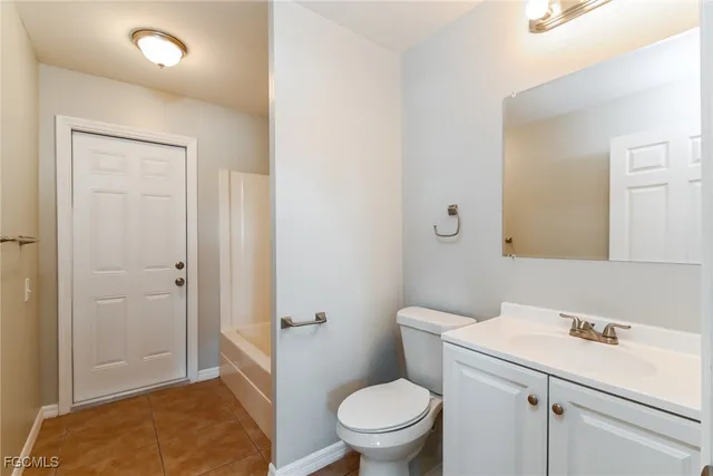 a bathroom with a sink toilet and vanity