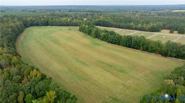 a view of a bench in backyard of a house