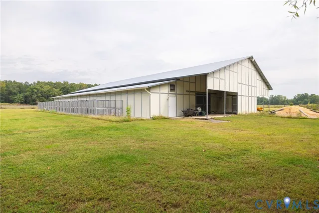 a view of a couches and dinning table in the balcony