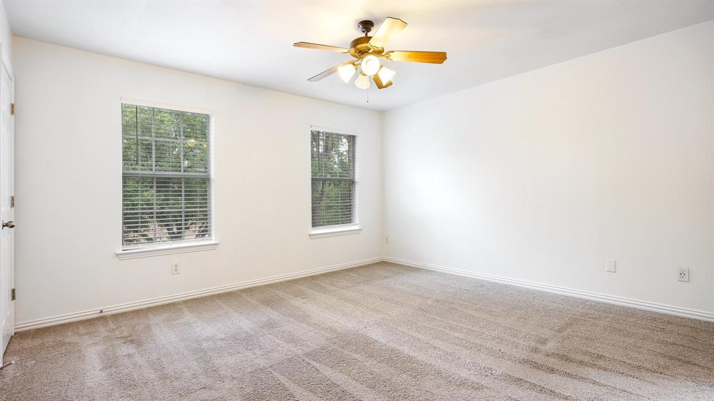 3206 Bedford Road Bedford, TX 76021 - Photo 10 of 26 a view of an empty room with a window