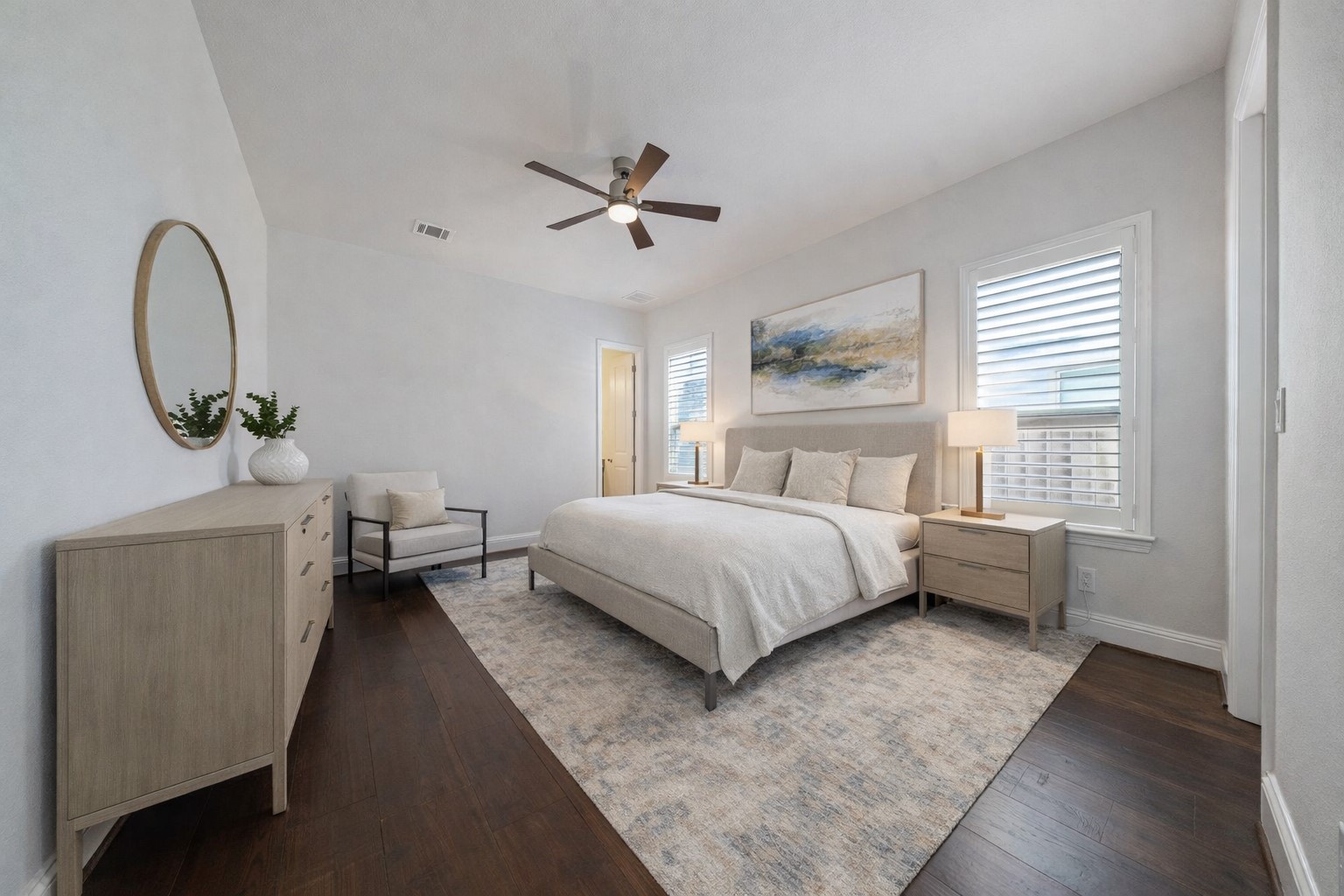 5403 Rouchel Brook Lane Sugar Land, TX 77479 - Photo 17 of 42 Thoughtfully customized, this secondary bedroom lives like a second primary suite- conveniently located on the first floor and enhanced with soft neutral tones, wood flooring, and abundant natural light. Complete with a spacious private en-suite bath. Virtually staged.