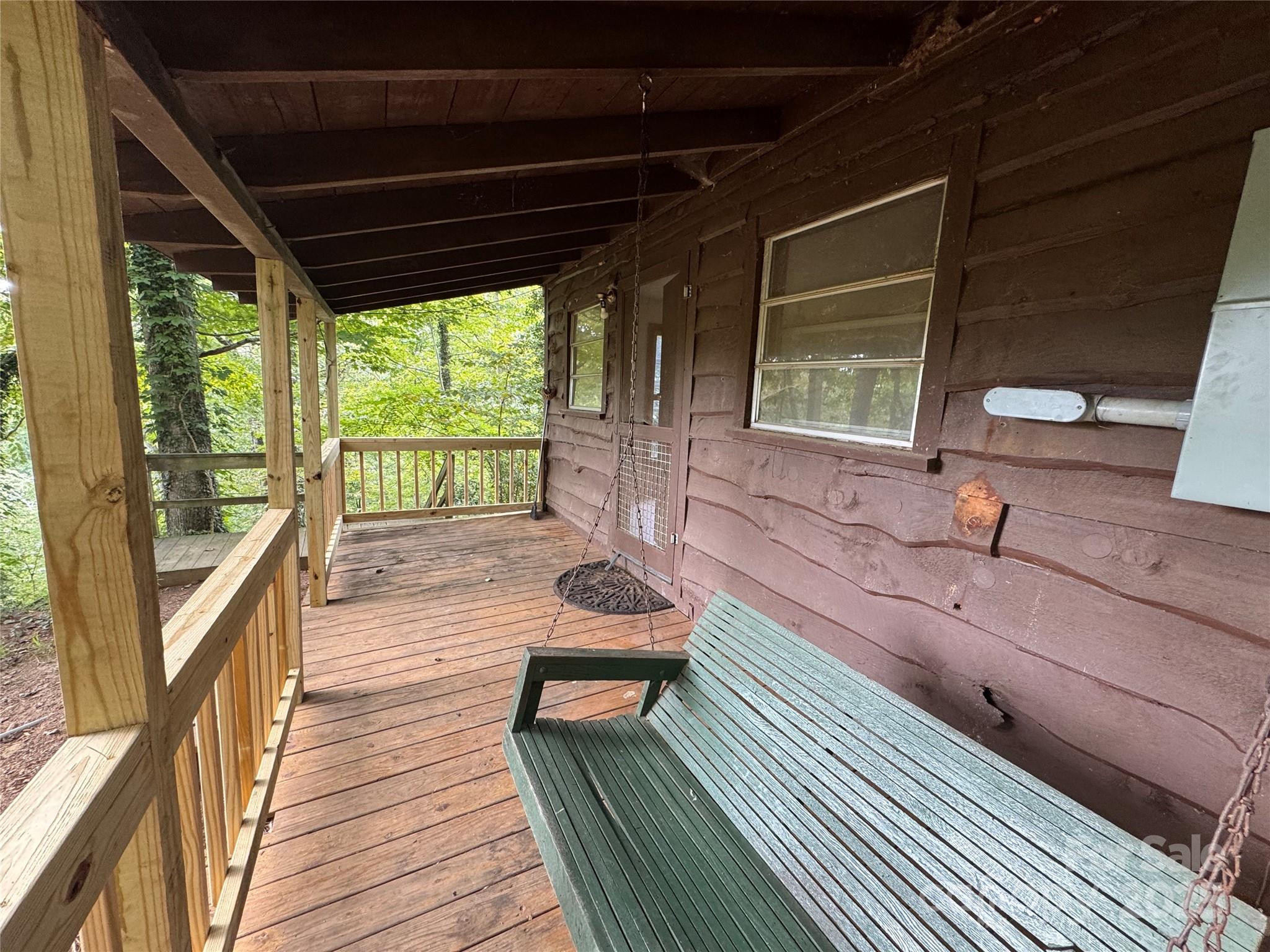 84 Pelohi Cove Road Bryson City, NC 28713 - Photo 16 of 22 a outdoor space with wooden floor and windows