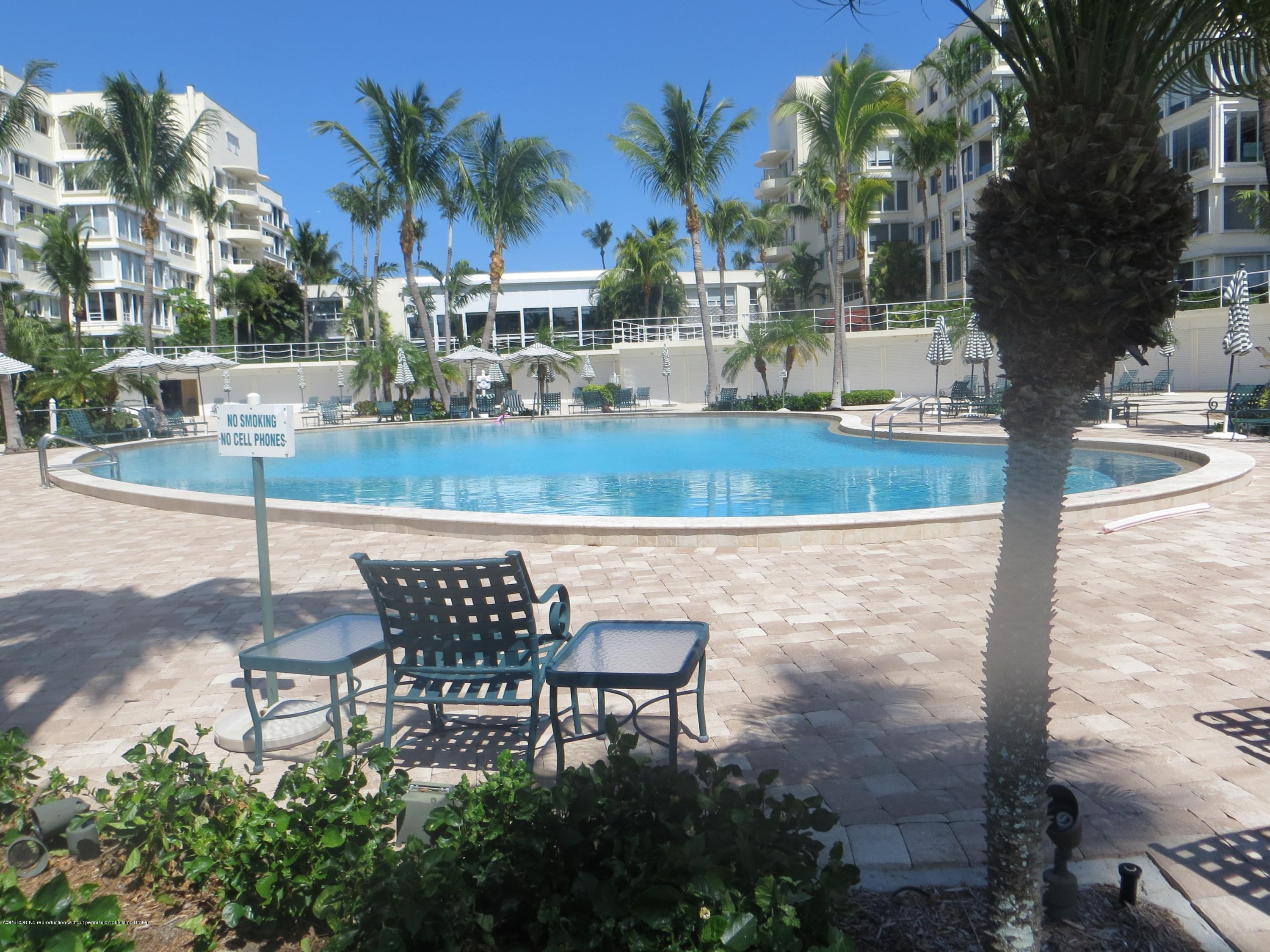 44 Cocoanut Row, Unit 308B Palm Beach, FL 33480 - Photo 1 of 14 a view of a chairs and table in the patio